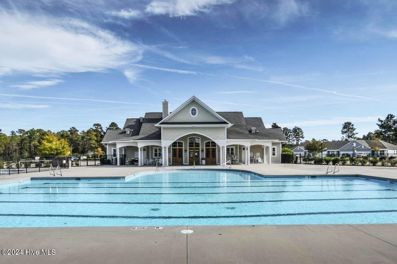 Community pool and clubhouse. Neighbors love to meet at the pool and clubhouse for social gatherings. - 2012 Willowleaf Drive Lot 02, Leland, NC 28451
