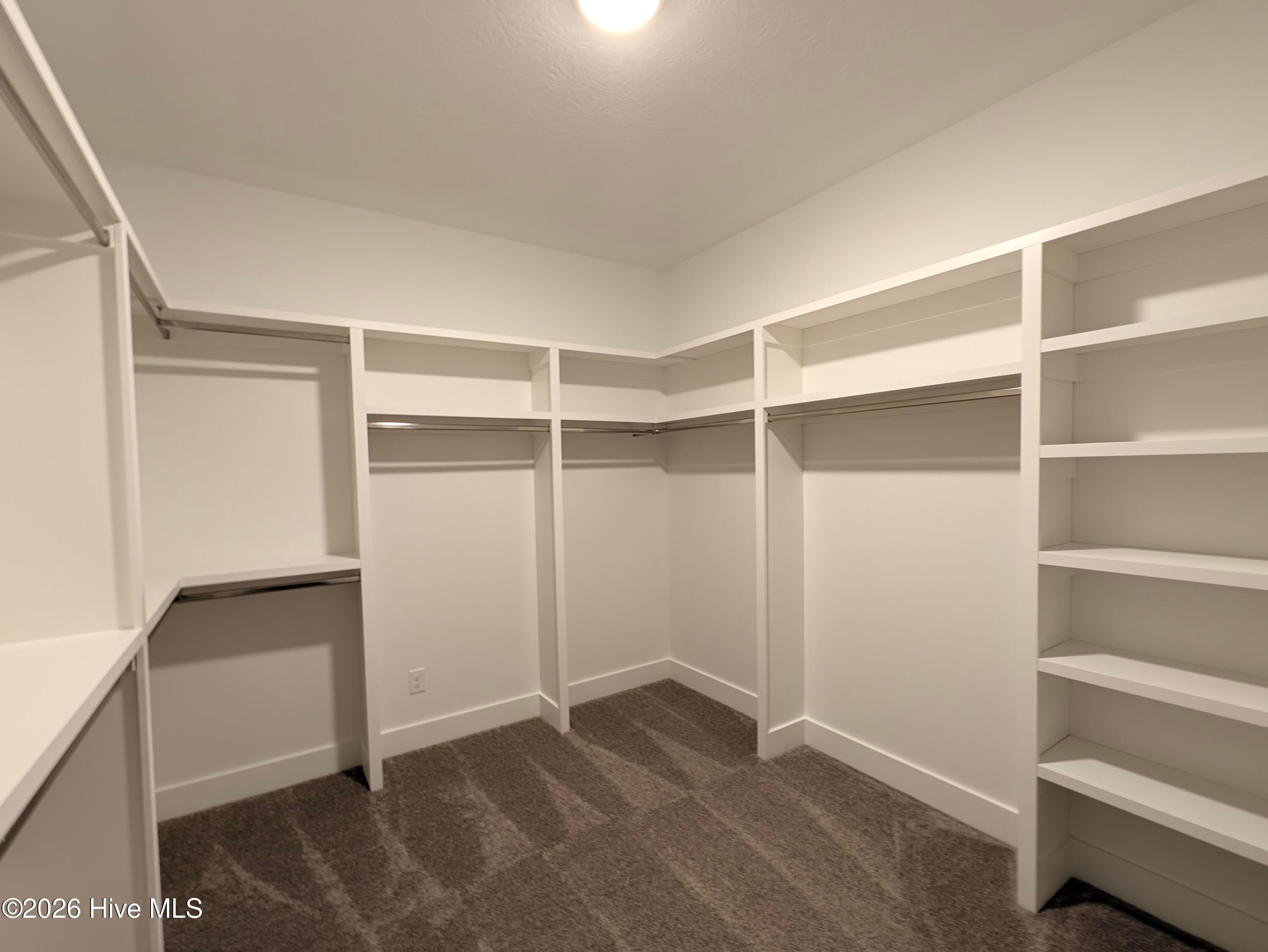 Custom wood-shelved Primary closet - 434 Longshadow Drive, Aiken, SC 29803
