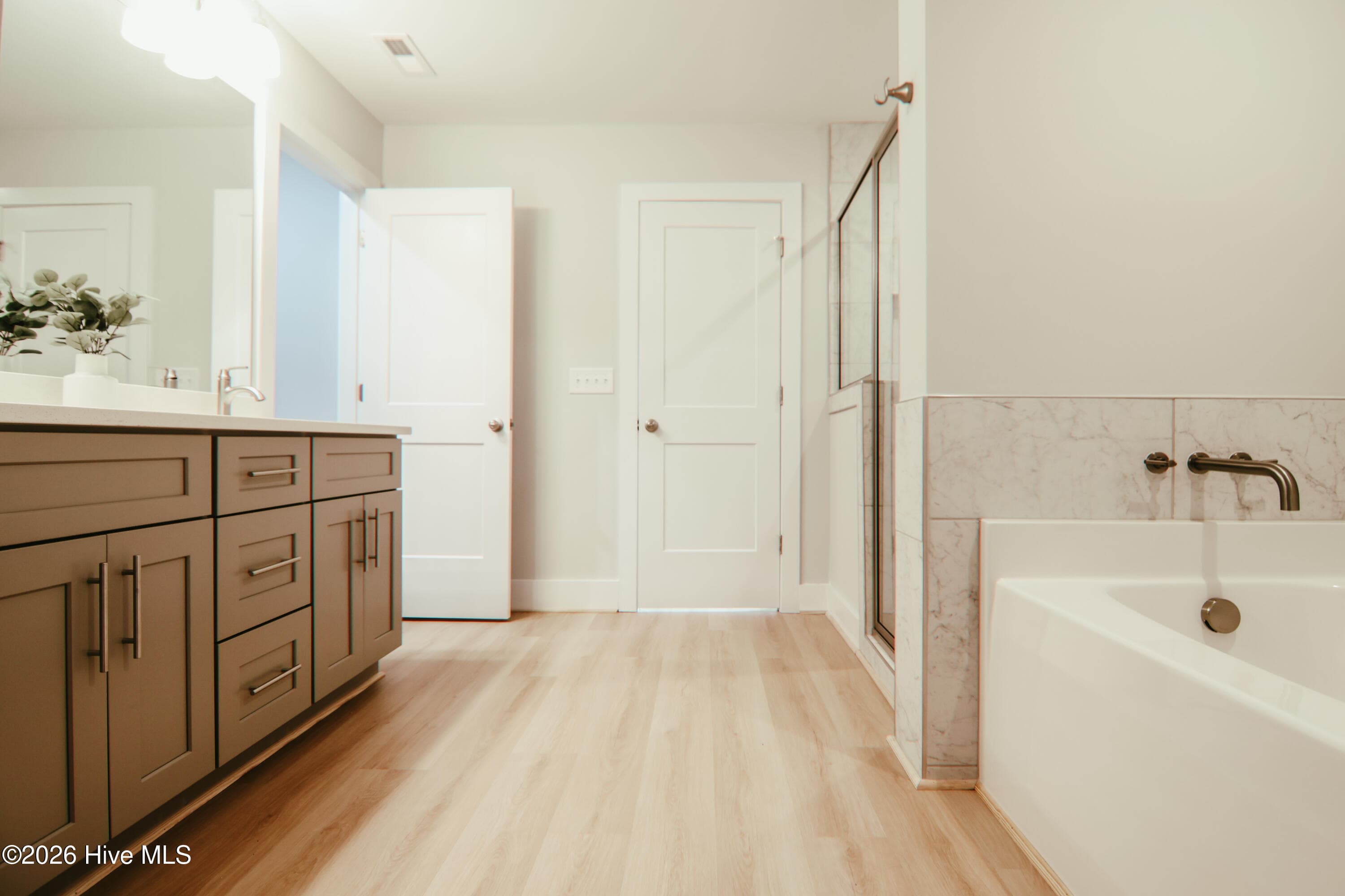 Master bathroom with LVP flooring - 223 Glenwood Trail, Goldsboro, NC 27534