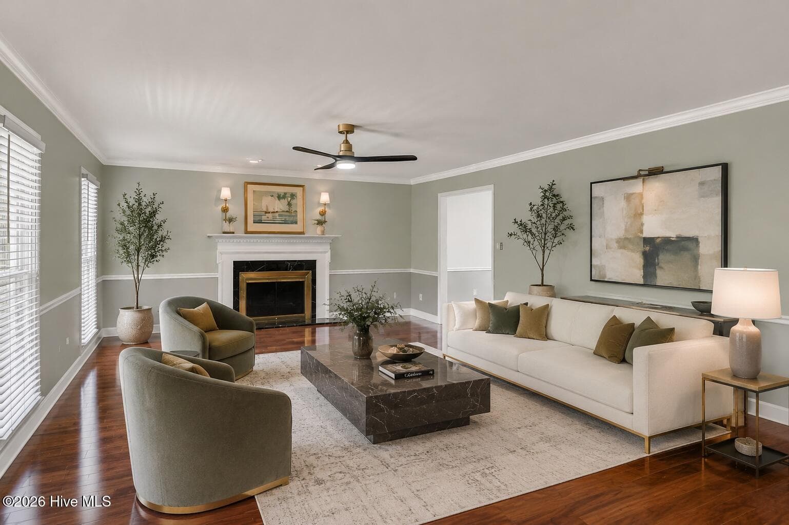 A bright and inviting oversized living room with hardwood floors, a classic fireplace, and plenty of space to relax or entertain. - 16 Rapids Court, North Augusta, SC 29841