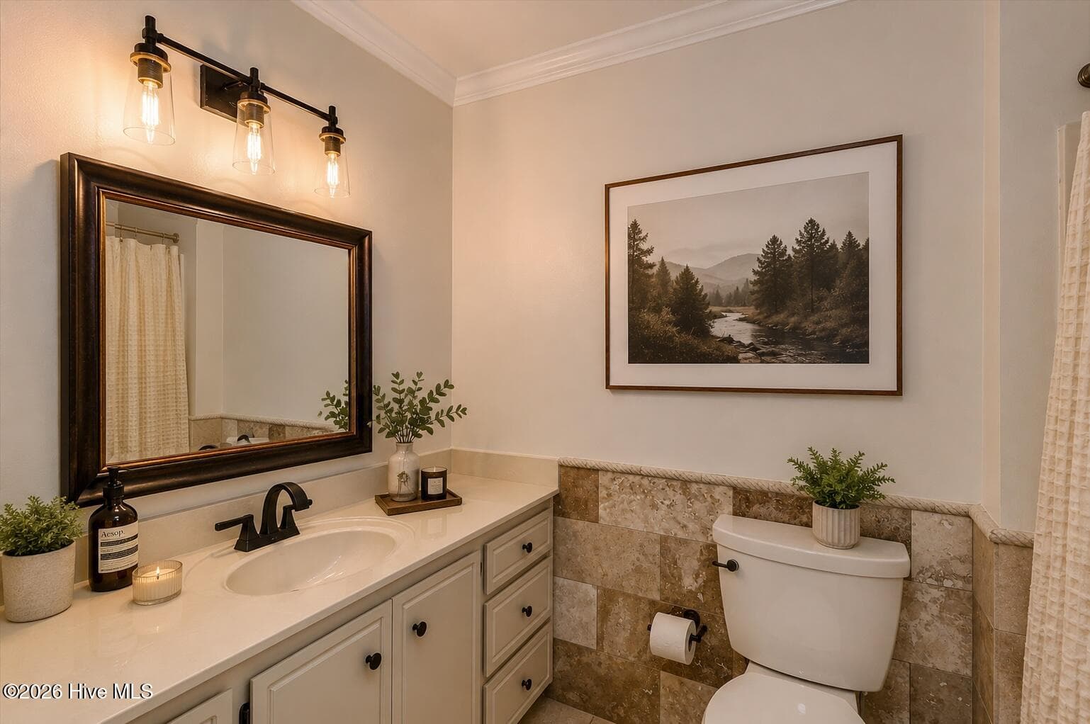 Bathroom 2 Upstairs: A thoughtfully styled upstairs bath with warm finishes, updated lighting, and a clean, polished feel. - 16 Rapids Court, North Augusta, SC 29841