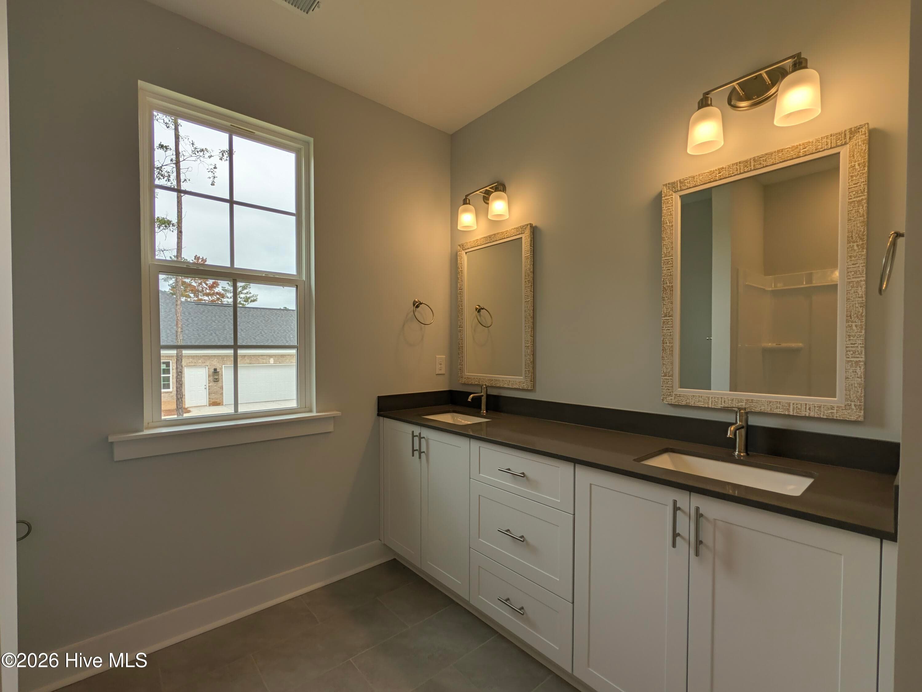 dual-vanity sinks in secondary, shared bathroom - 434 Longshadow Drive, Aiken, SC 29803