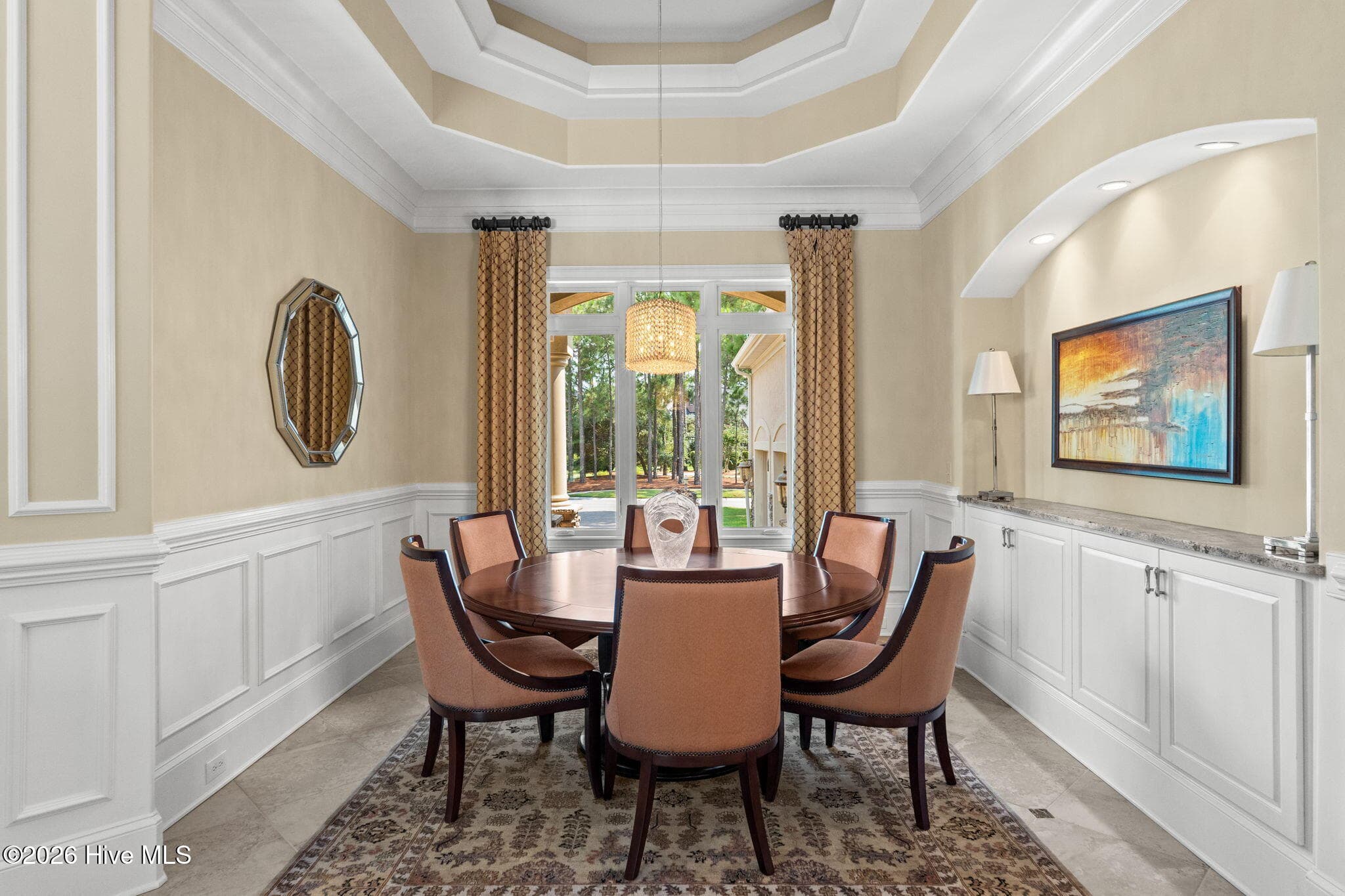 Formal dining room with tray ceiling , built-in buffet and custom millwork. - 3858 Ridge Crest Drive, Southport, NC 28461