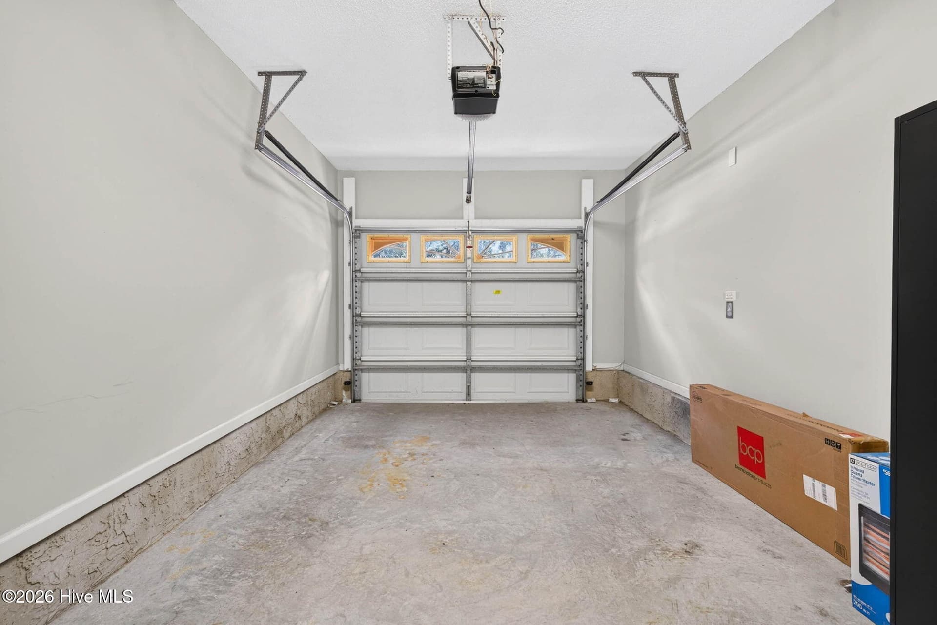 Attached one-car garage provides valuable covered parking and additional storage for beach gear, bikes, and more. - 1650 Frink Street SW, Ocean Isle Beach, NC 28469