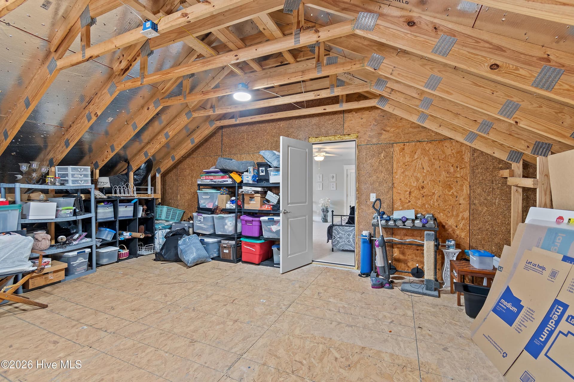 Large storage room attached to upstairs bonus room. Lots of options with this space. - 6358 Bryson Drive SW, Ocean Isle Beach, NC 28469