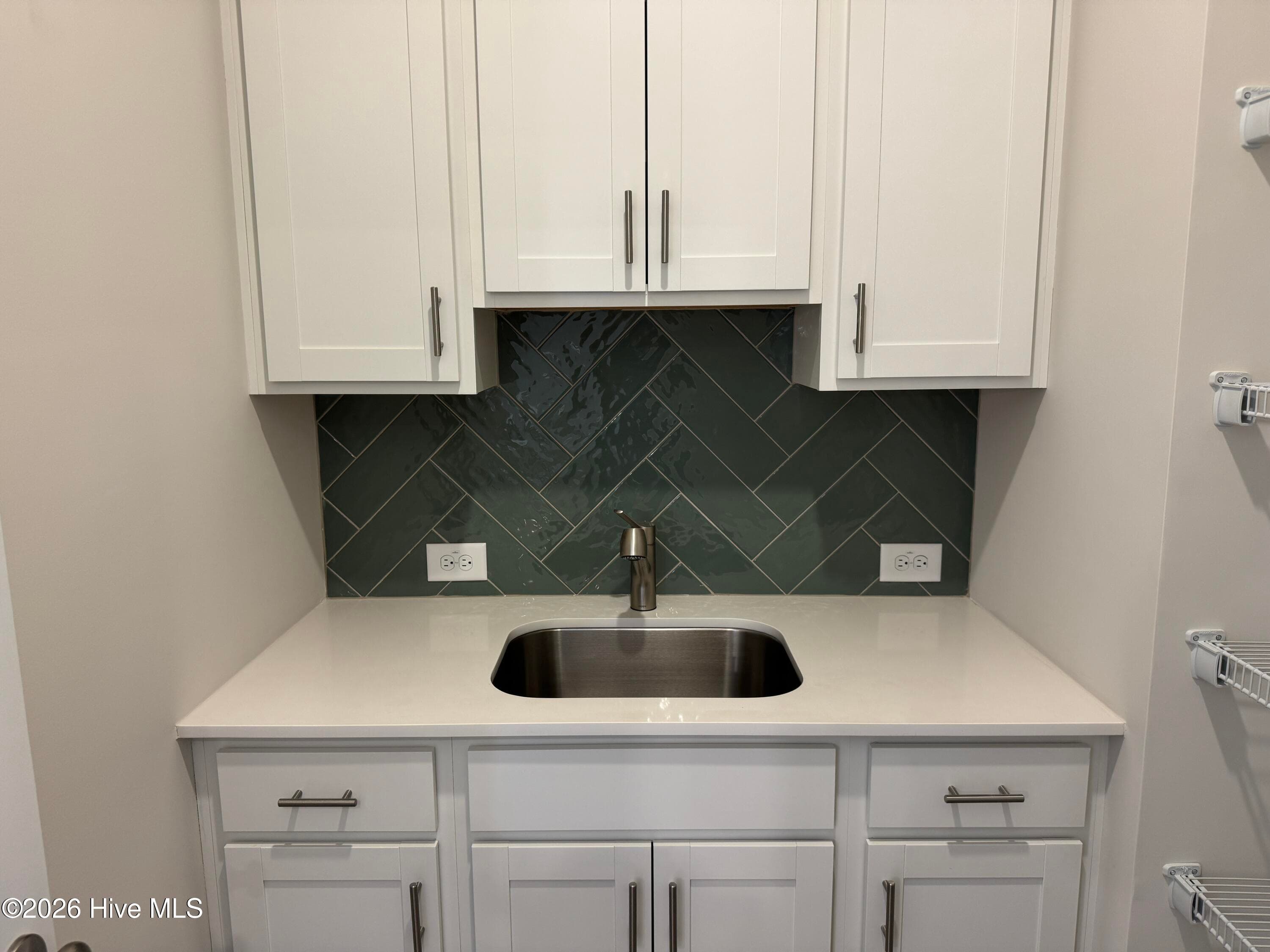 Elegant Kitchen includes Deluxe Pantry, Quartz Countertops, Stainless Appliances, Tile Backsplash, and Beautiful Lighting fixtures. - 4145 Workman Loop 66, Leland, NC 28451