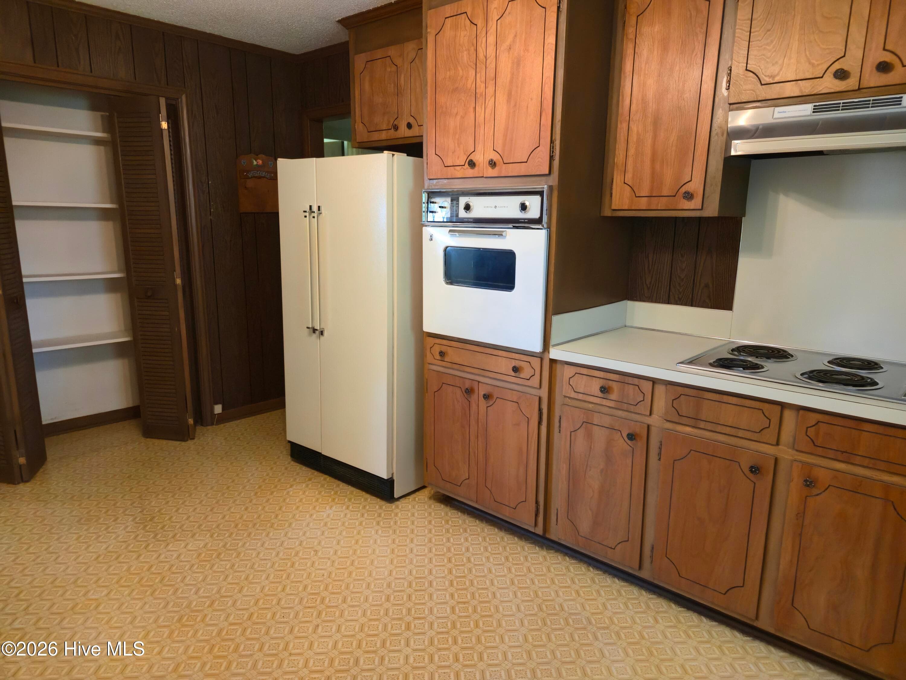 Kitchen features lots of cabinet space plus a pantry - 725 Clayton Street, Rocky Mount, NC 27803