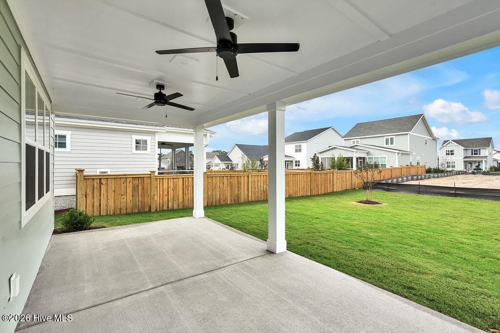 Large covered back porch overlooking oversized backyard - 5202 Moonshell Loop, Wilmington, NC 28412