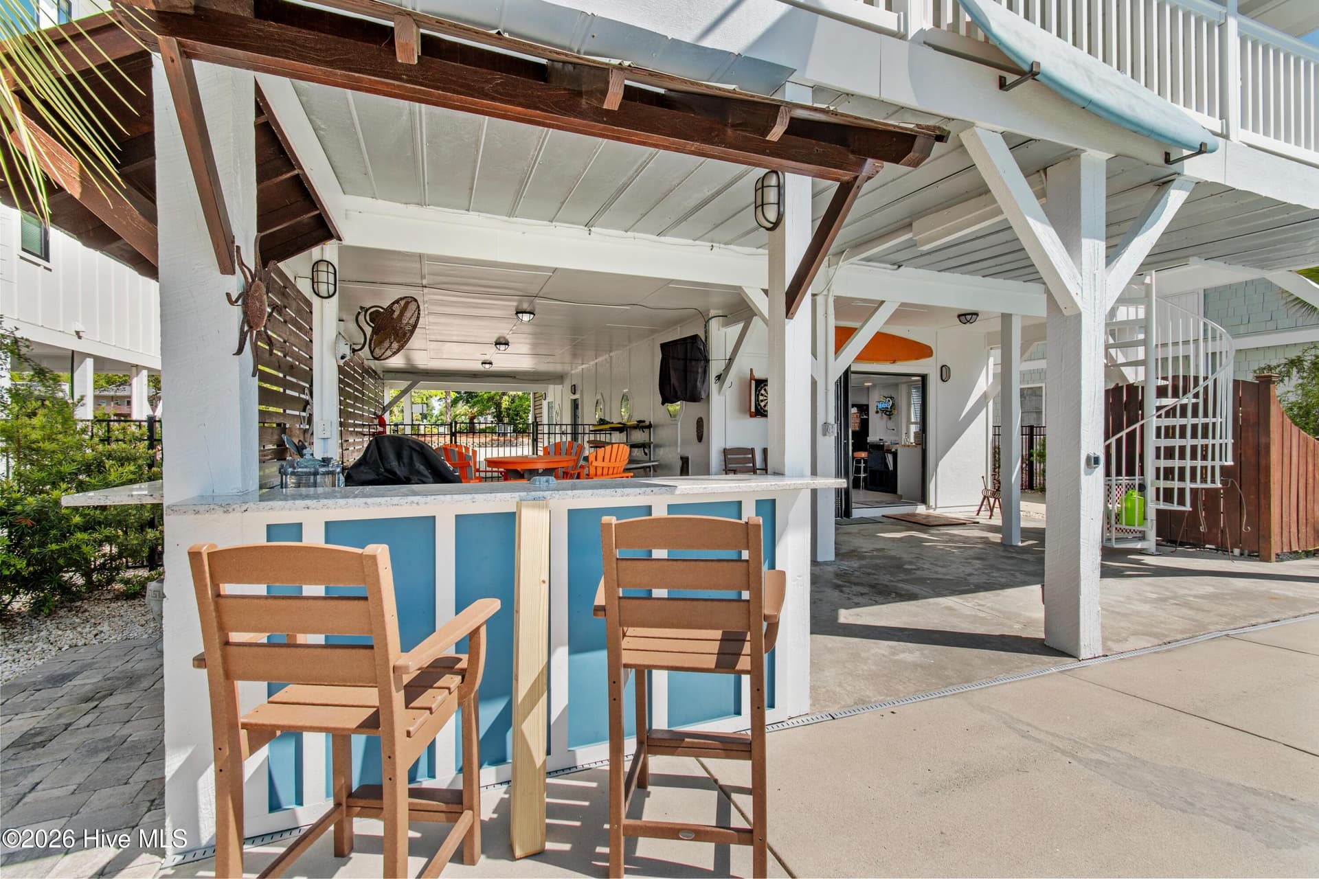 Outdoor seating at the grilling station/tiki bar. - 2024 Camelot Drive SW, Ocean Isle Beach, NC 28469