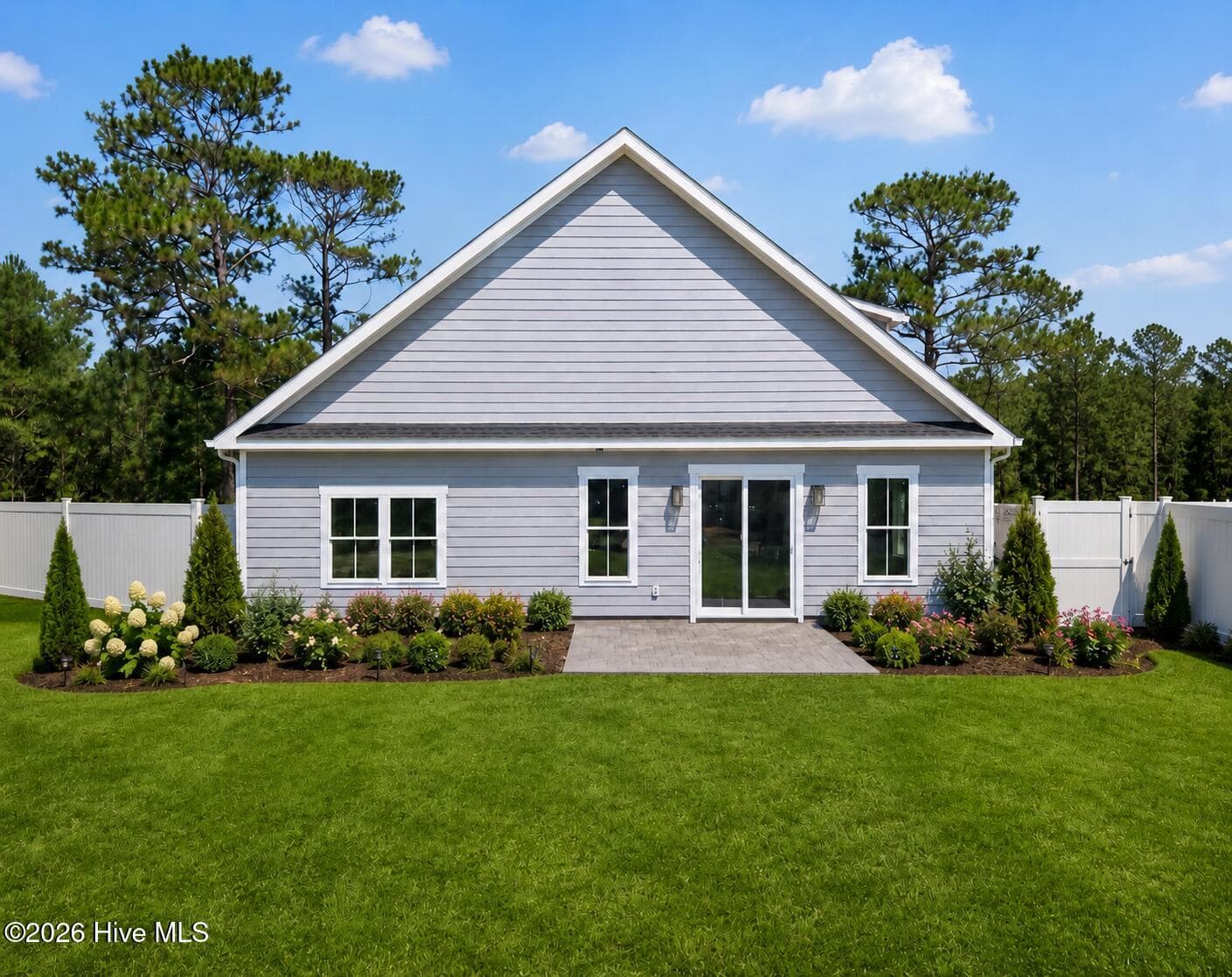 photo ai enhanced with landscaping. - 6089 Martinque Street SW, Shallotte, NC 28470