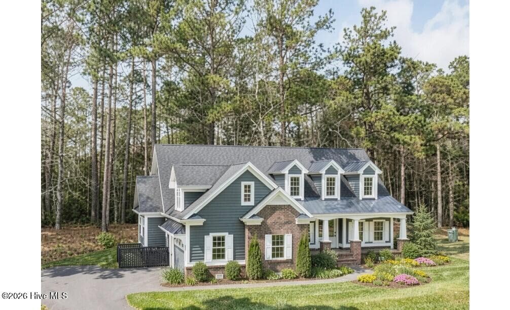 this is an example of a custom designed side load garage that fit comfortably on this very flexible nature preserve homesite - 526 57 Lindgrove Place SW, Ocean Isle Beach, NC 28469
