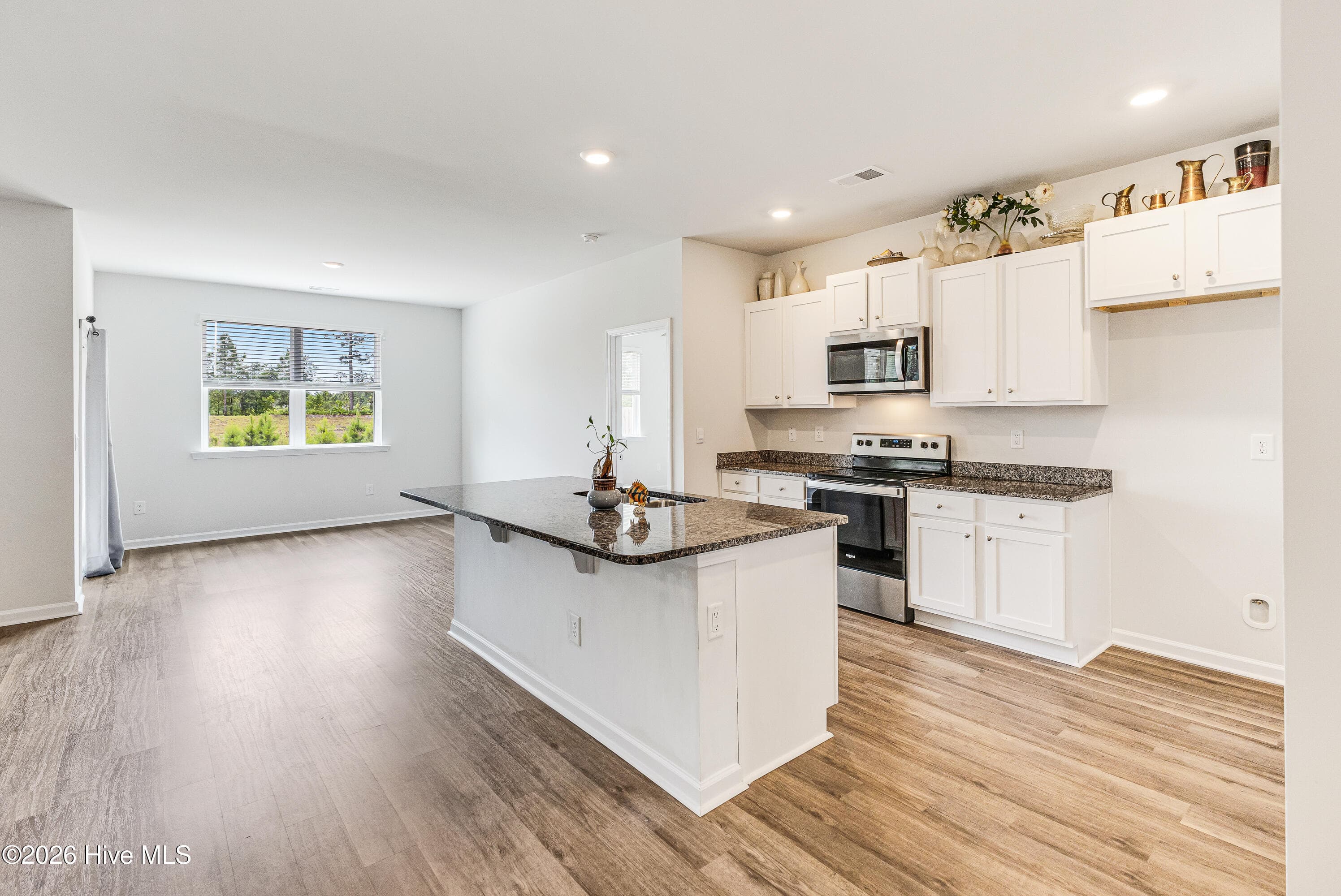 Open concept kitchen dining area - 1038 Burled Oak Ridge Loop SE, Bolivia, NC 28422
