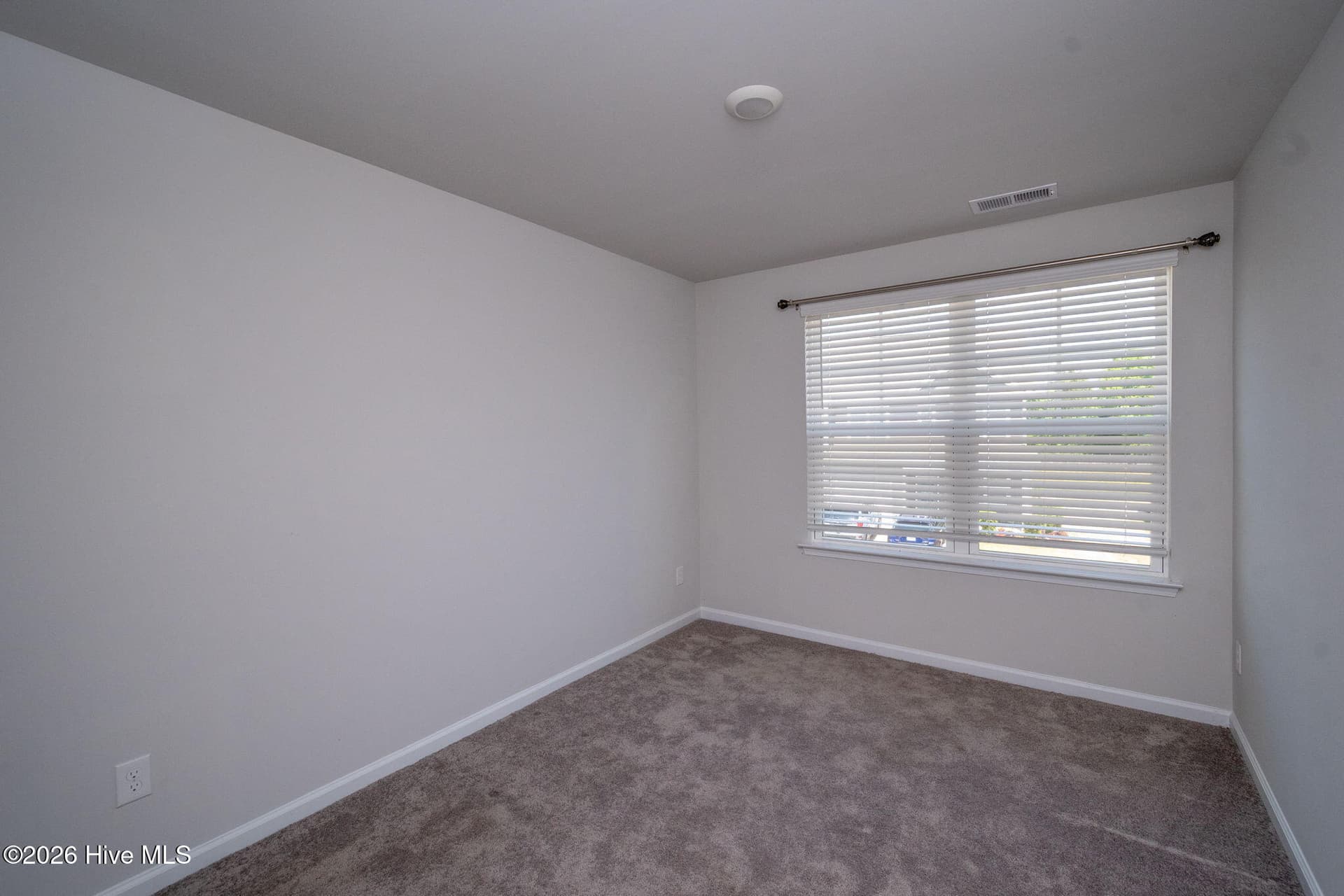Bedroom 2 looking towards the street - 7619 Knightbell Circle, Leland, NC 28451