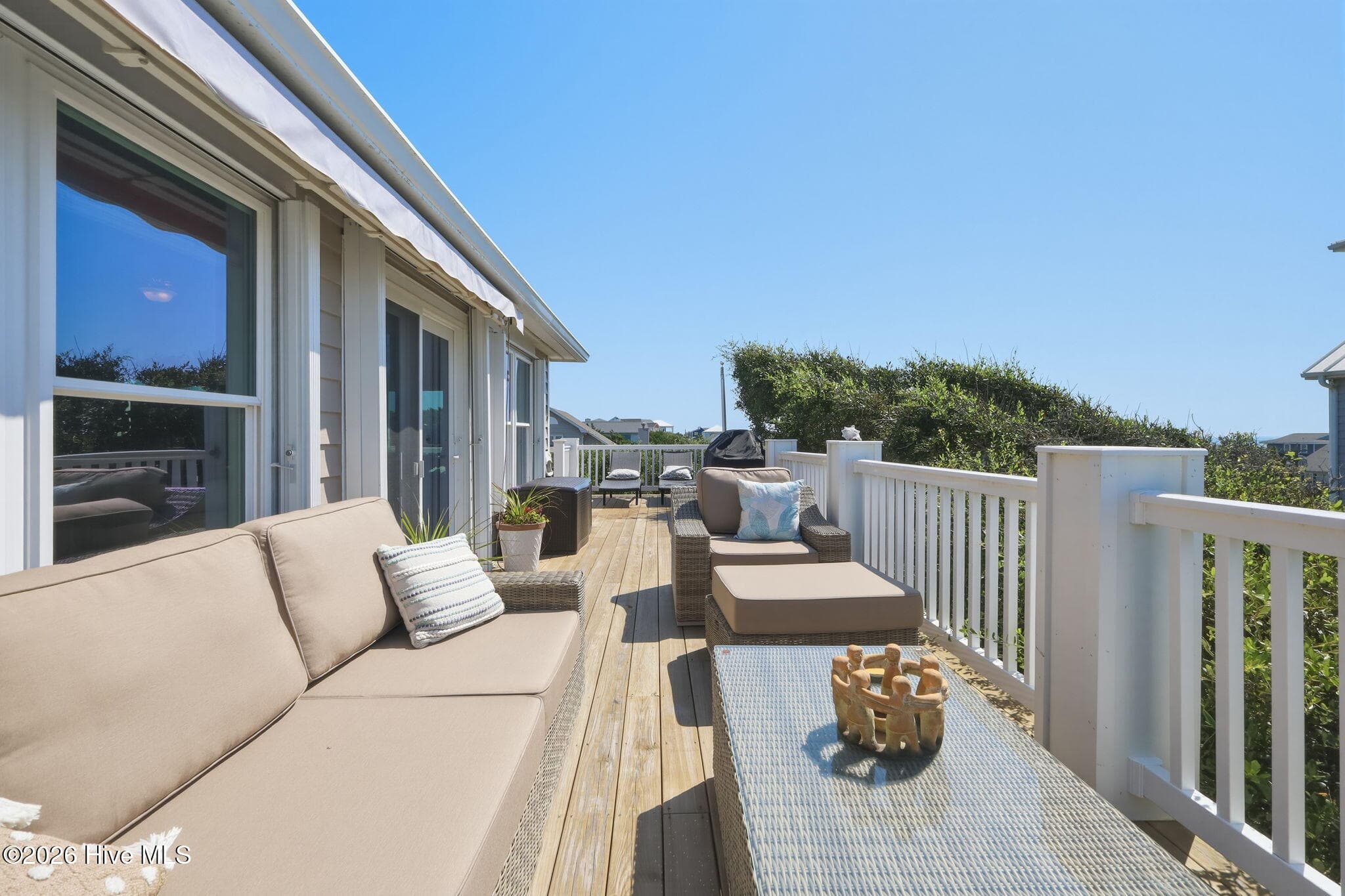 Enjoy ocean views and refreshing coastal breezes from the spacious outdoor decks. - 103 Georgia Street, Emerald Isle, NC 28594