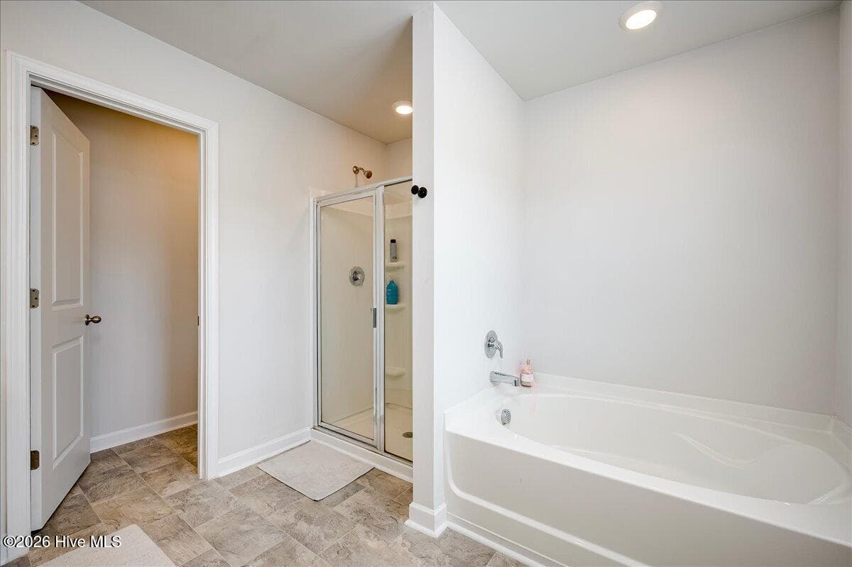 Primary bathroom garden tub and walk in shower - 1136 Button Buck Lane, Grovetown, GA 30813
