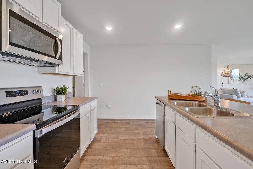 The photos you see here are for illustration purposes only, interior and exterior features, options, colors and selections will vary from the homes as built. - 1110 Pampas Grass Drive Lot 340, Castle Hayne, NC 28429