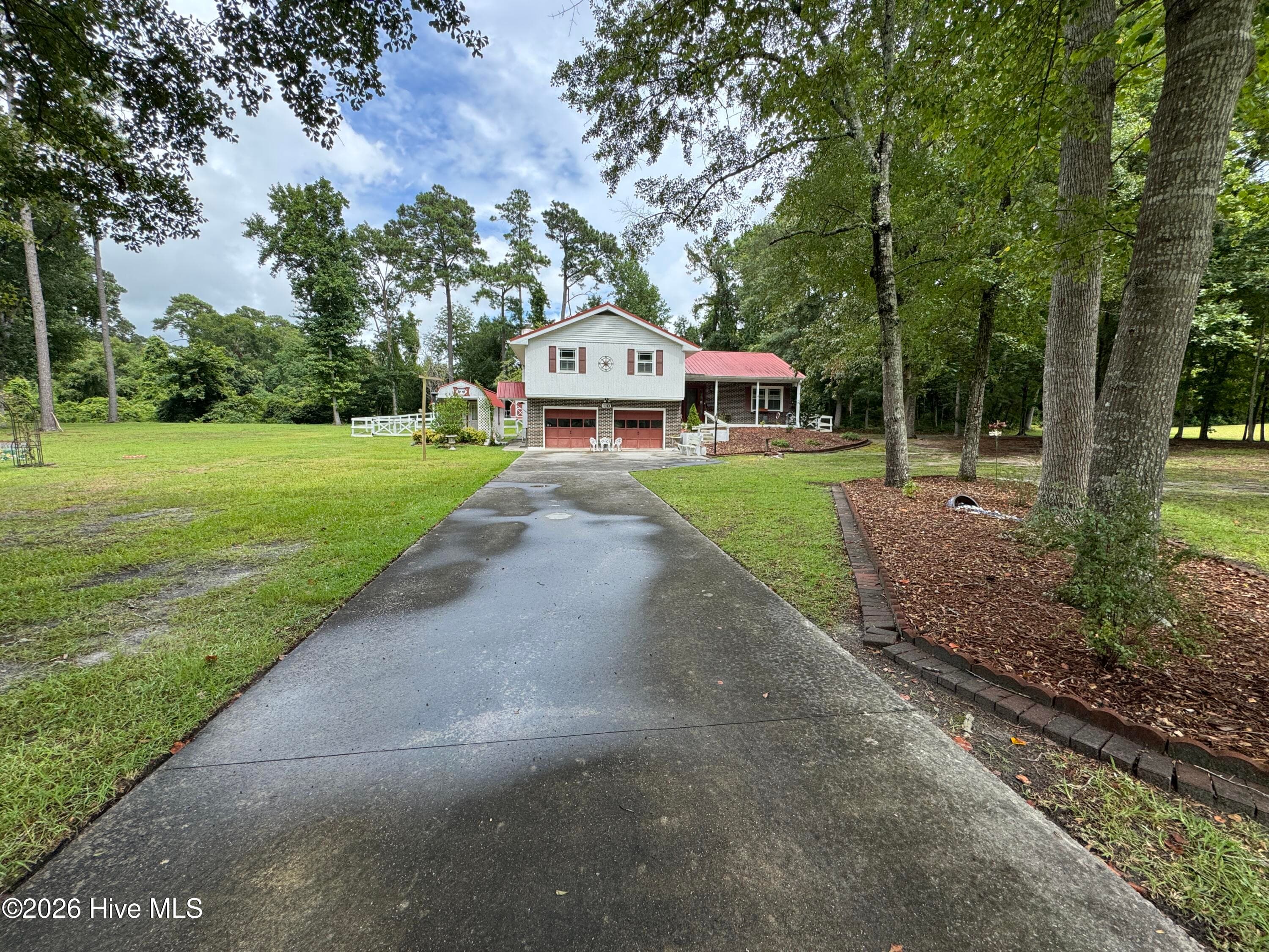 Looking down the driveway from the road. - 118 Oakwood Drive, Havelock, NC 28532