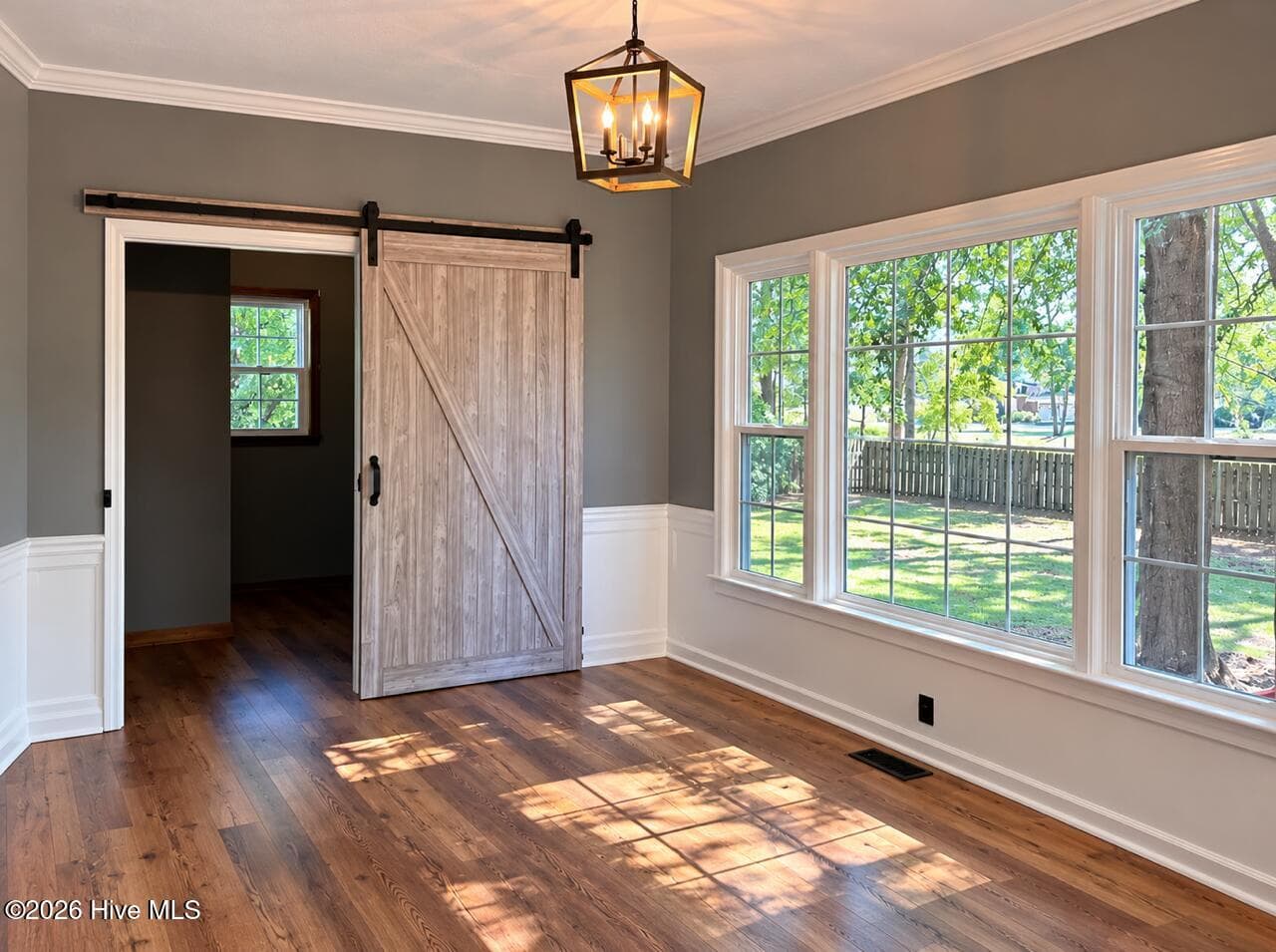Large breakfast room with tons of natural light. Sliding barn door to laundry rm. Beautiful new flooring, updated lighting and new windows. - 4164 Quail Springs Circle, Augusta, GA 30907