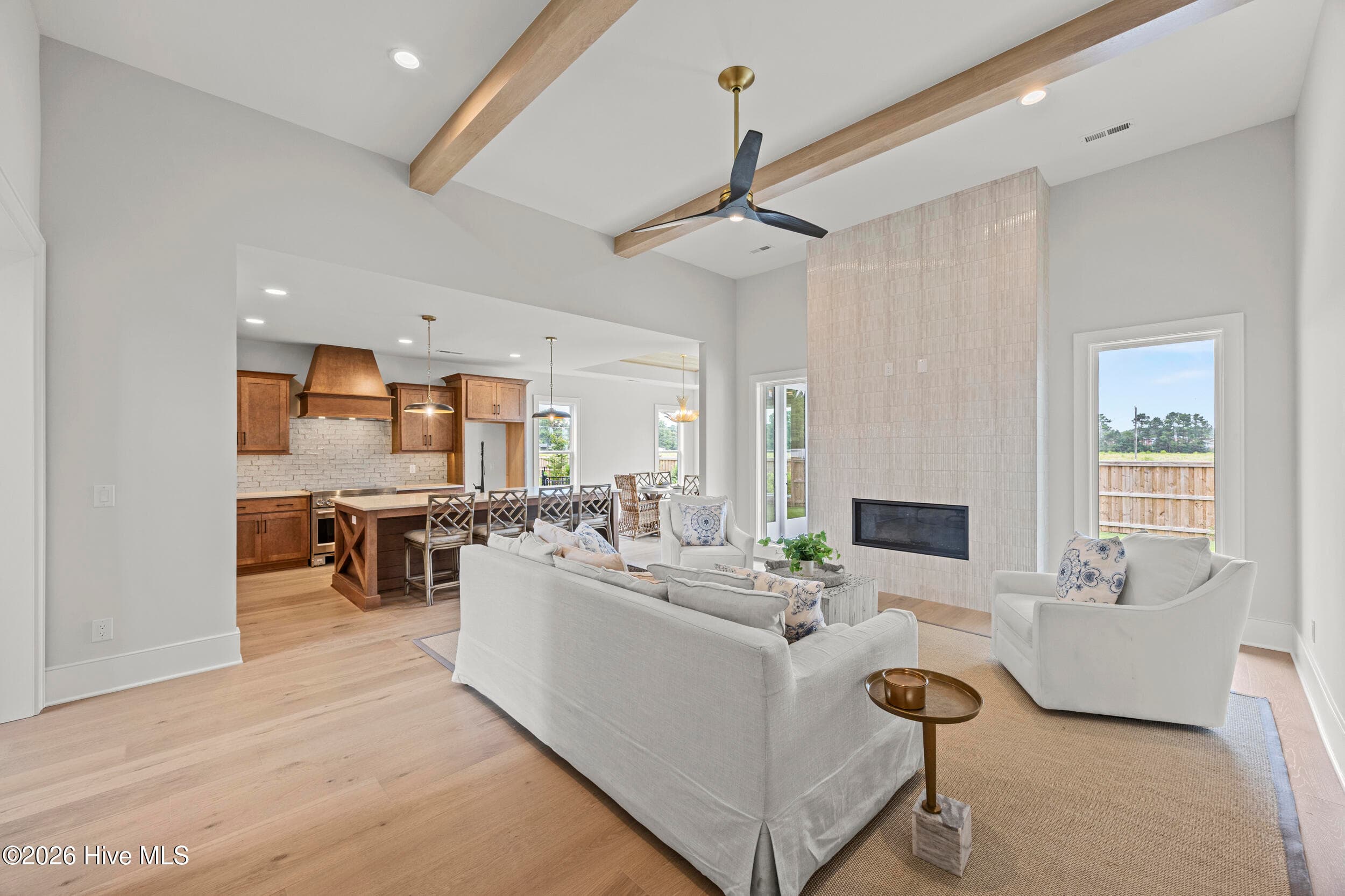 Living Room with custom beams and tile fireplace - 117 Grand Harvest Court, Wilmington, NC 28411