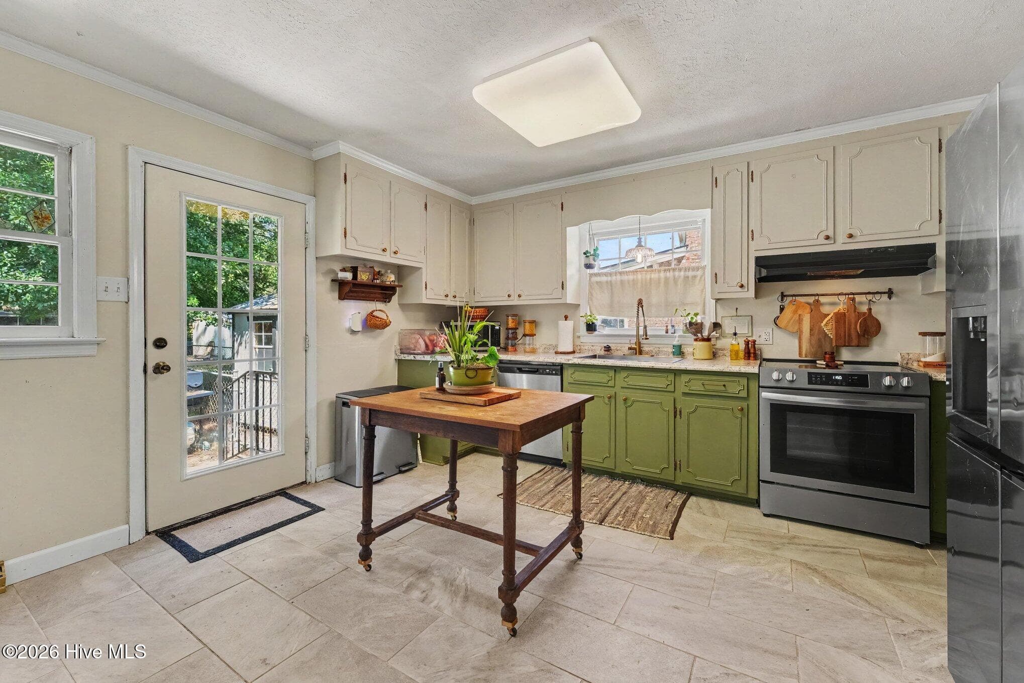 Kitchen with tile flooring and stainless steel appliances - 1017 S Claiborne Street, Goldsboro, NC 27530