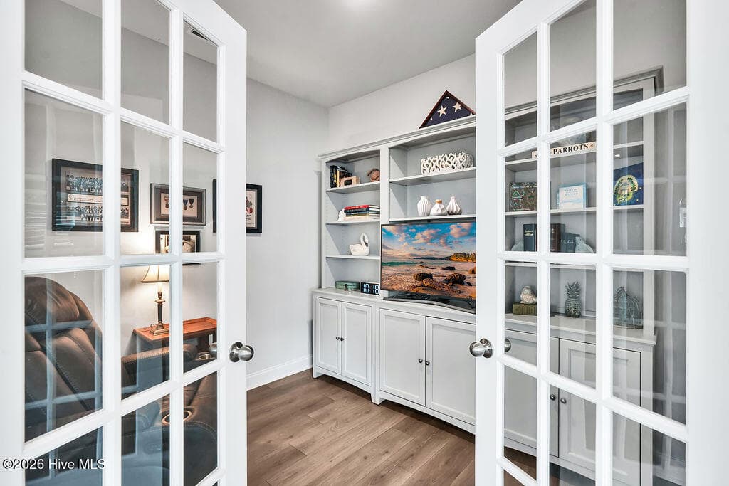 Just off of the living room, this flex room makes a great study, office, playroom, media room, exercise or craft room. - 142 Rice Marsh Way, Wilmington, NC 28412