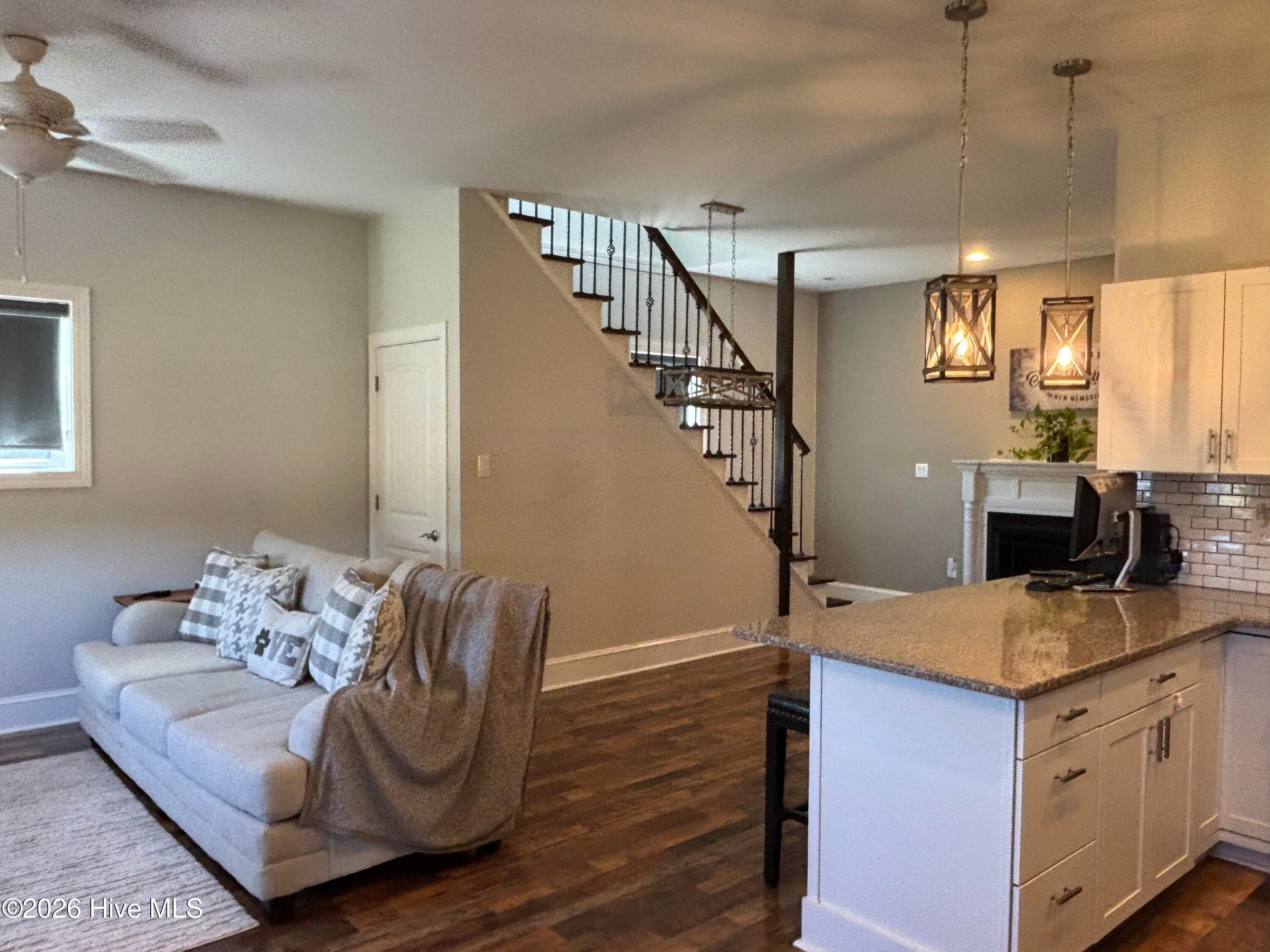 Kitchen open to dining area and living area with stairs to bedroom - 593 La Wane Lane, Trenton, NC 28585