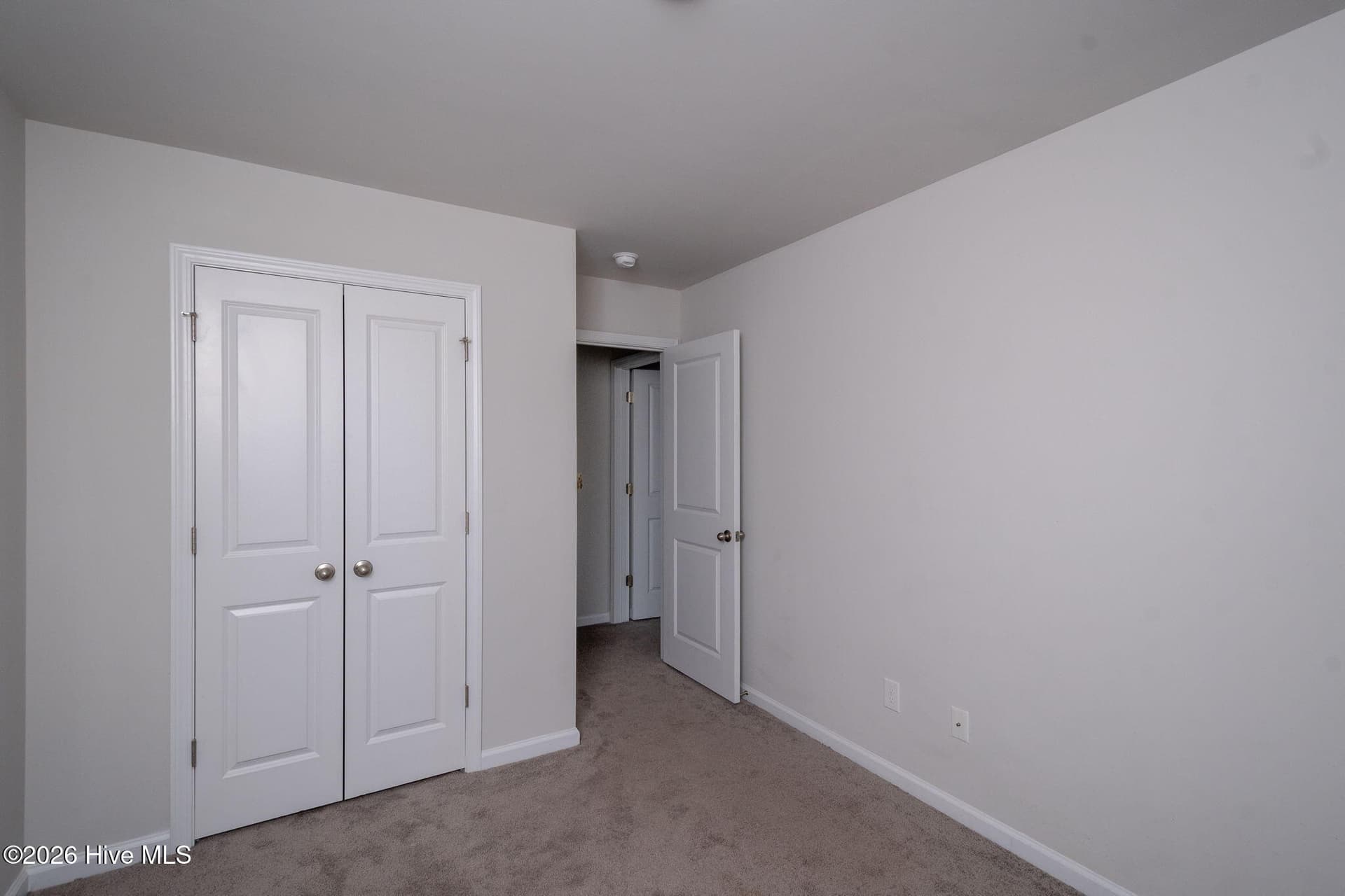 Bedroom 1 looking towards the Hall - 7619 Knightbell Circle, Leland, NC 28451