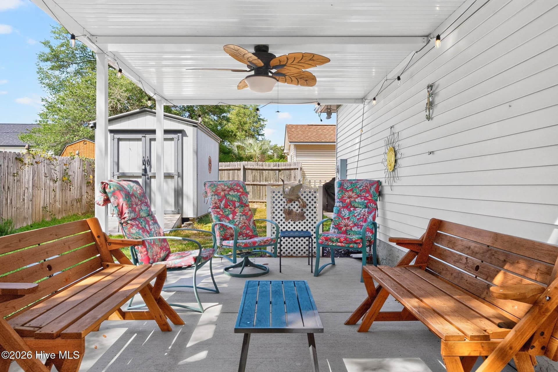 Spacious covered patio creates an inviting outdoor living area for dining, relaxing, and enjoying the coastal climate. - 1650 Frink Street SW, Ocean Isle Beach, NC 28469