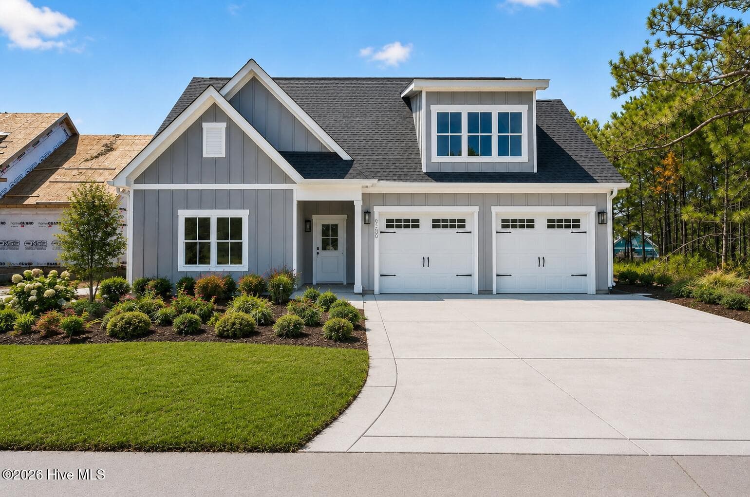 photo ai enhanced with landscaping. - 6089 Martinque Street SW, Shallotte, NC 28470