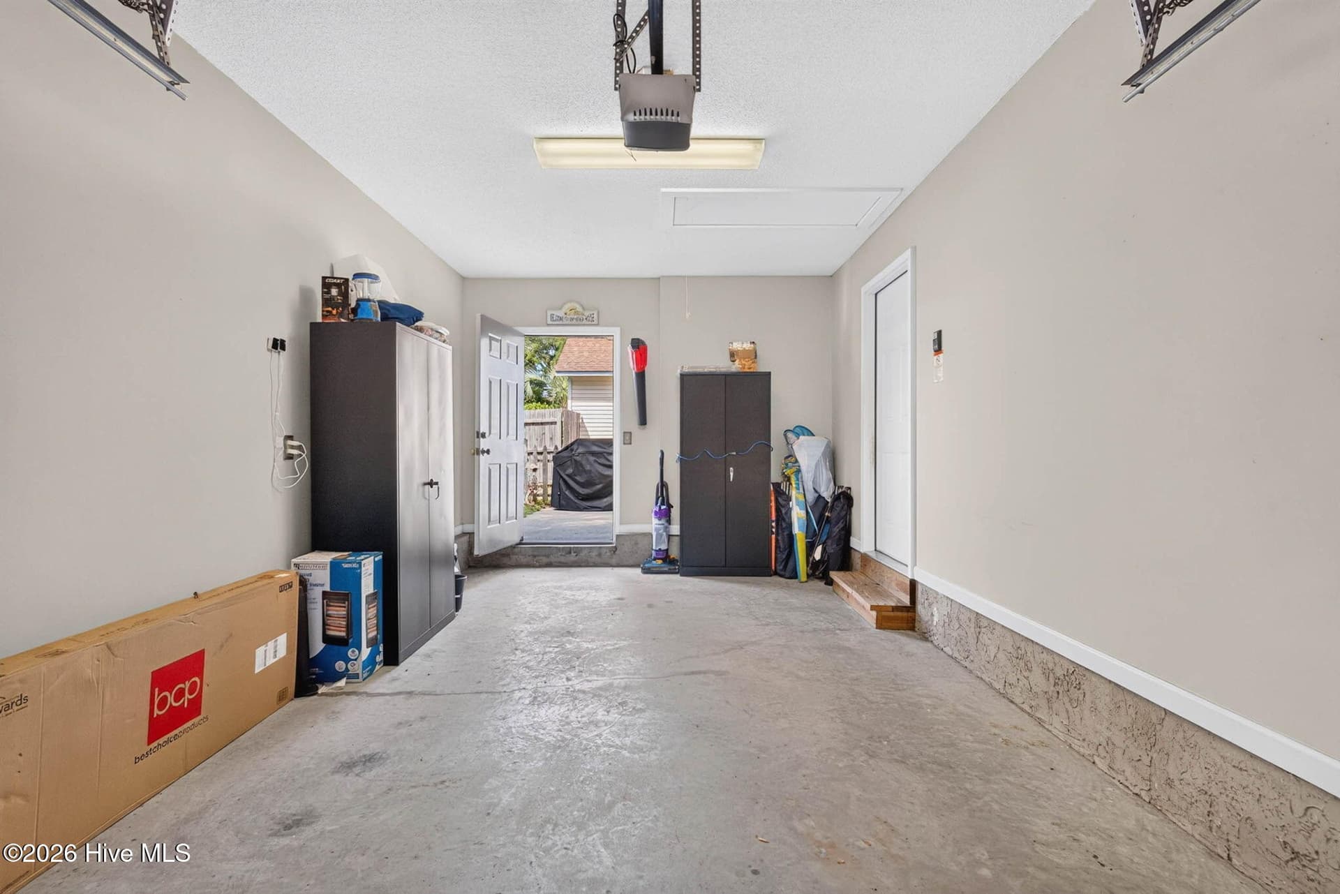 Generously sized attached garage offers parking plus valuable storage space just minutes from the beach. - 1650 Frink Street SW, Ocean Isle Beach, NC 28469