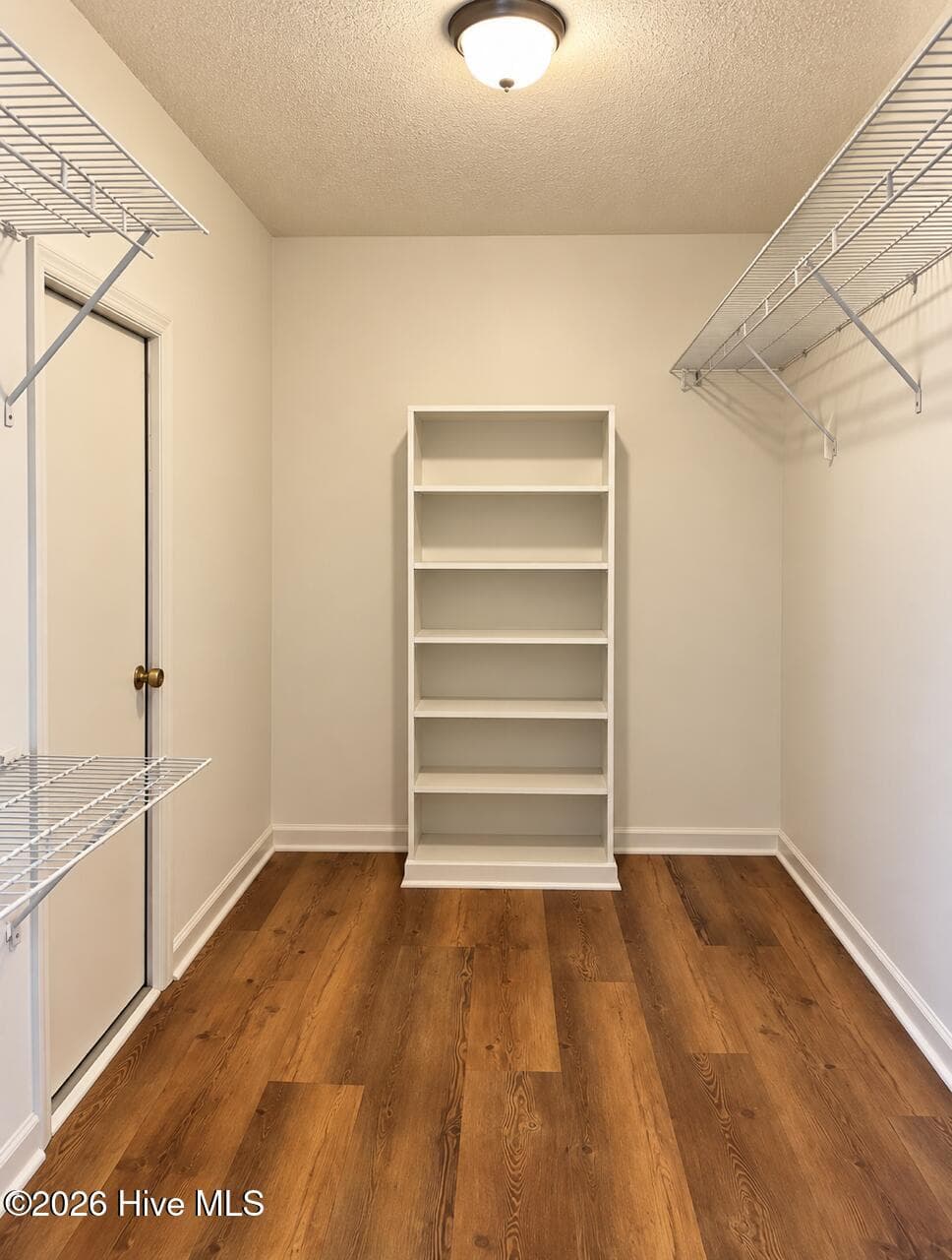 Great walk-in closet with built-ins and access door to floored and sheetrocked attic storage - 4164 Quail Springs Circle, Augusta, GA 30907