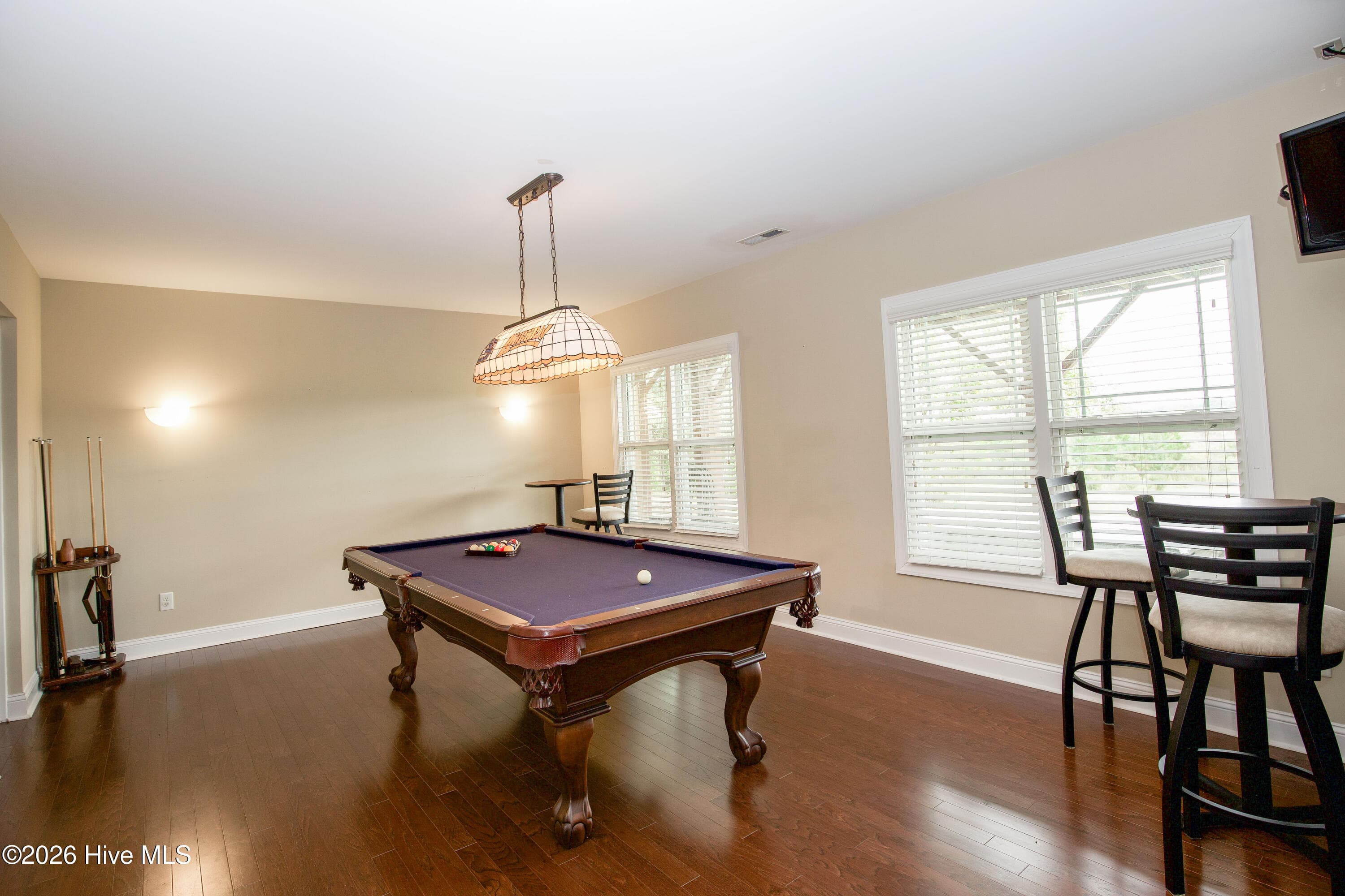 Lower-level media area with French doors to the covered patio. - 899 Seagull Drive, Vass, NC 28394, Vass