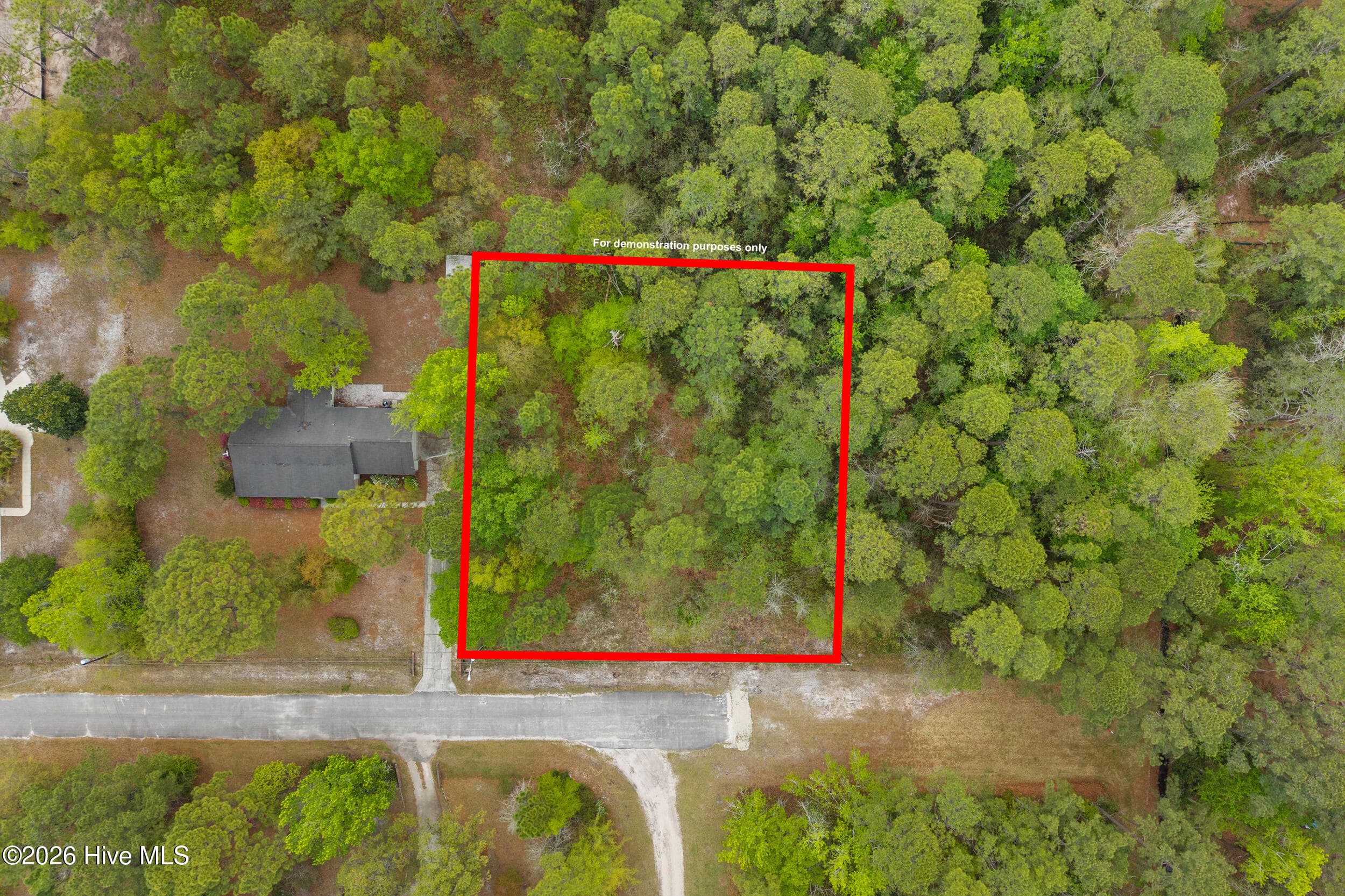 This lot measures approximately 150 feet across the front, with side boundaries of about 168 feet on the left and 169 feet on the right, and a rear boundary of roughly 150 feet. Boundary lines shown in red are for illustrative purposes only and should not be considered exact. - 3 3 Deer Run Road SW, Carolina Shores, NC 28467