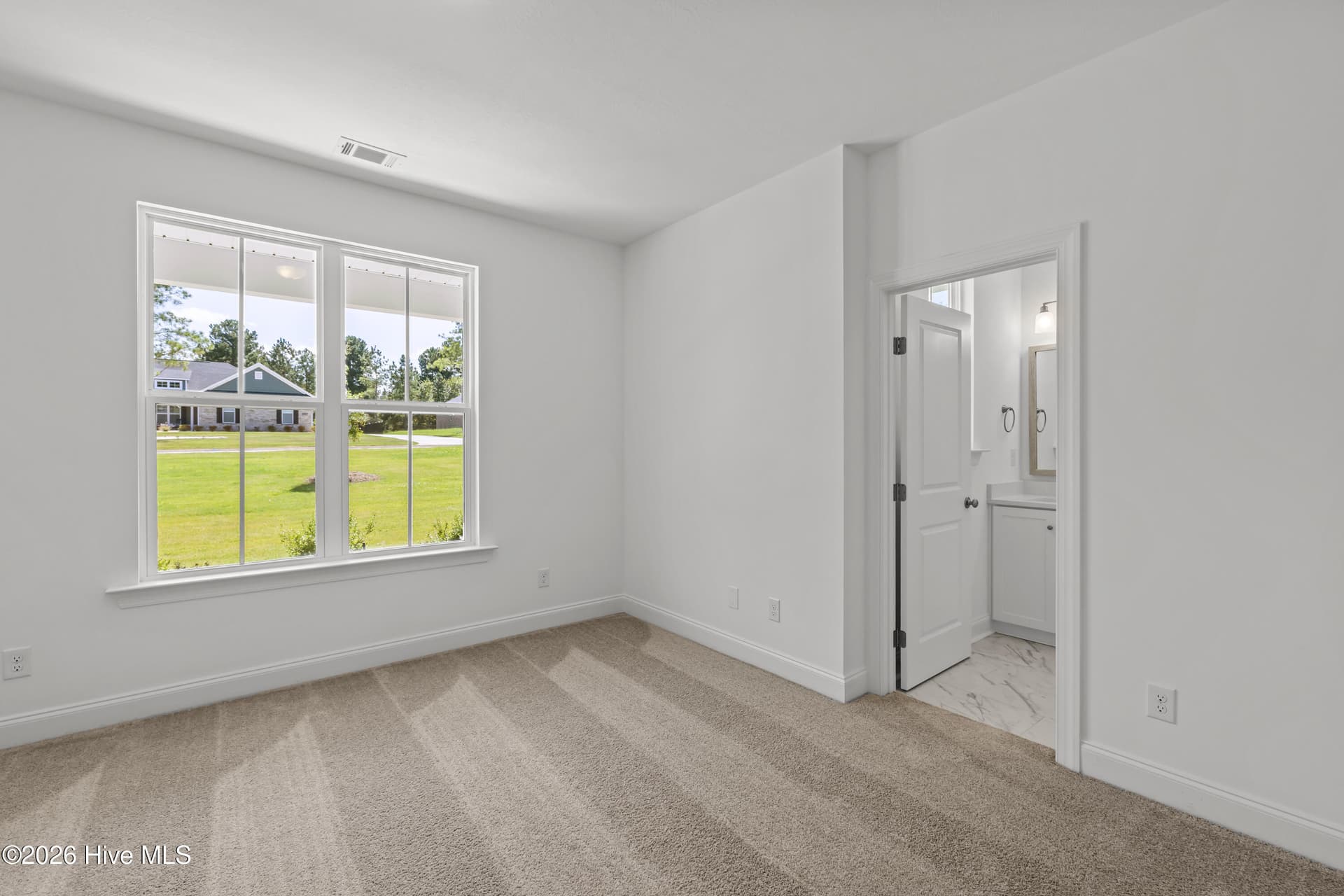 Bedroom 2 with a private full bath and walk in closet - 1550 Bellingham Drive, Beech Island, SC 29842