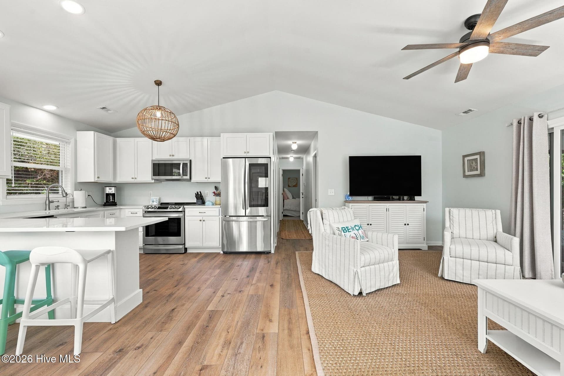 Open living room and kitchen with vaulted ceiling - 118 Periwinkle Drive, Emerald Isle, NC 28594