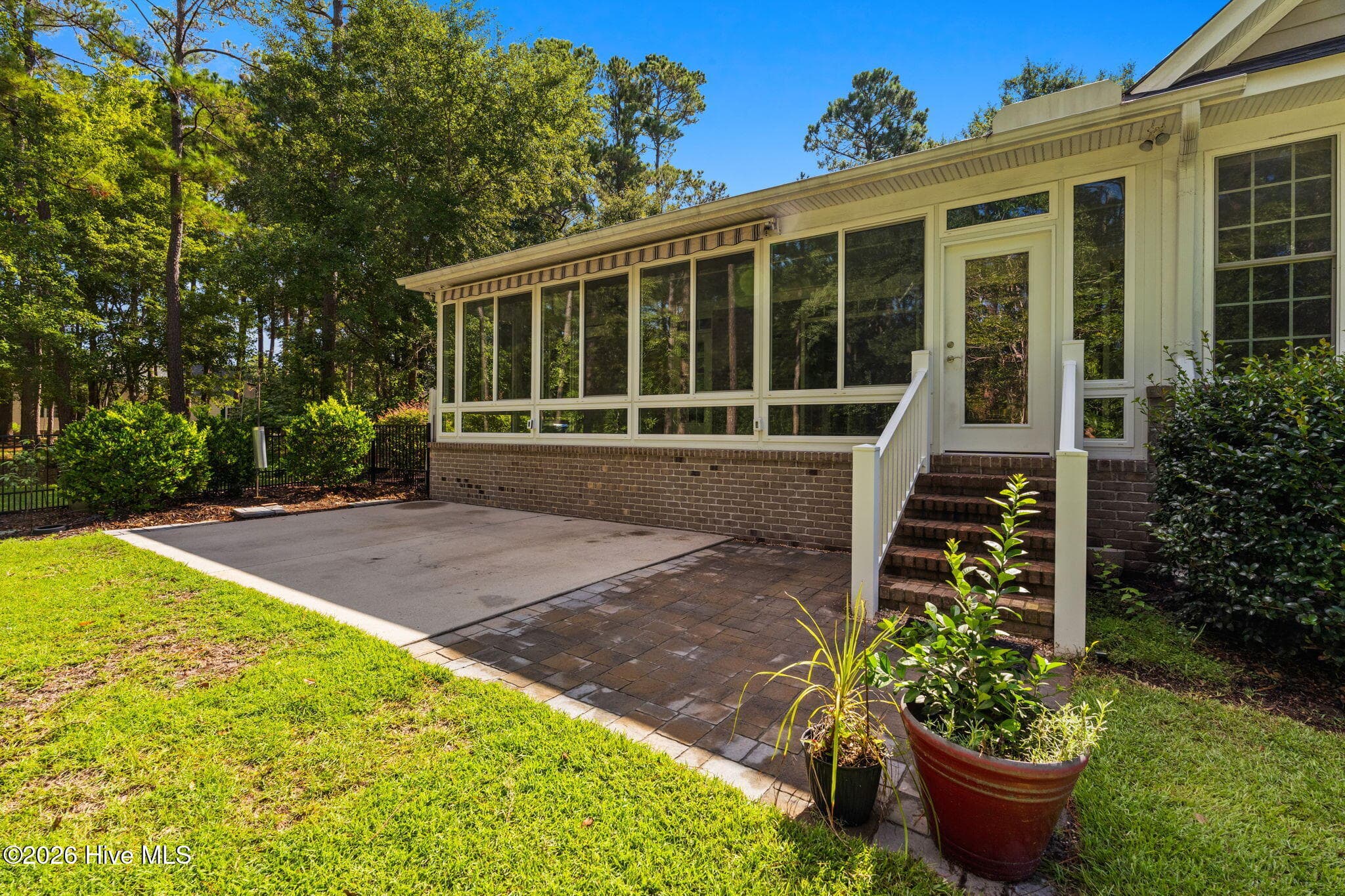 Rear Patio with Sun Setter Awning - 461 Springwood Drive SE, Bolivia, NC 28422