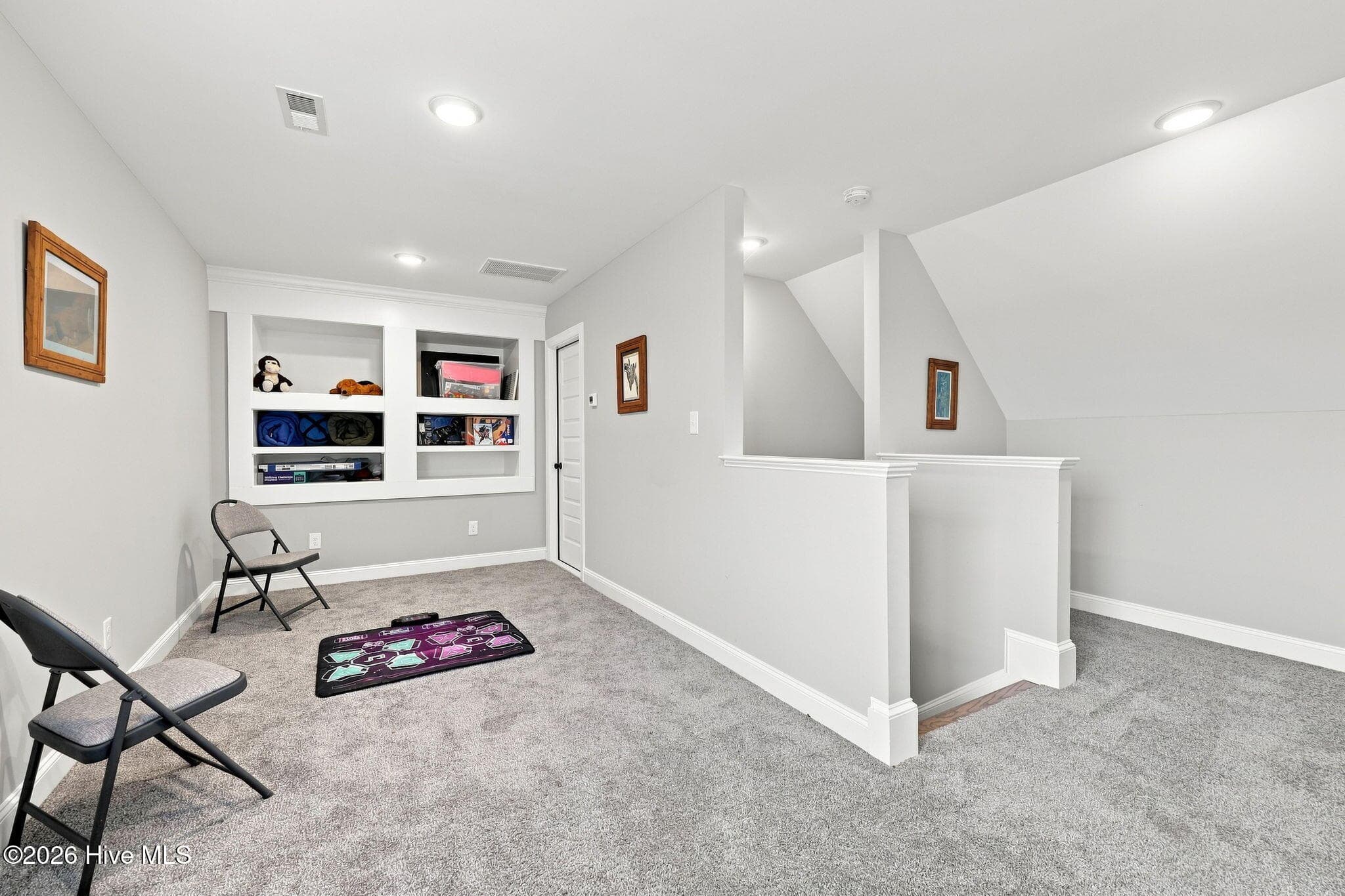Door to the right of built-ins leads to an extra large walk-in attic space! - 2212 Marinwood Court, Greenville, NC 27834