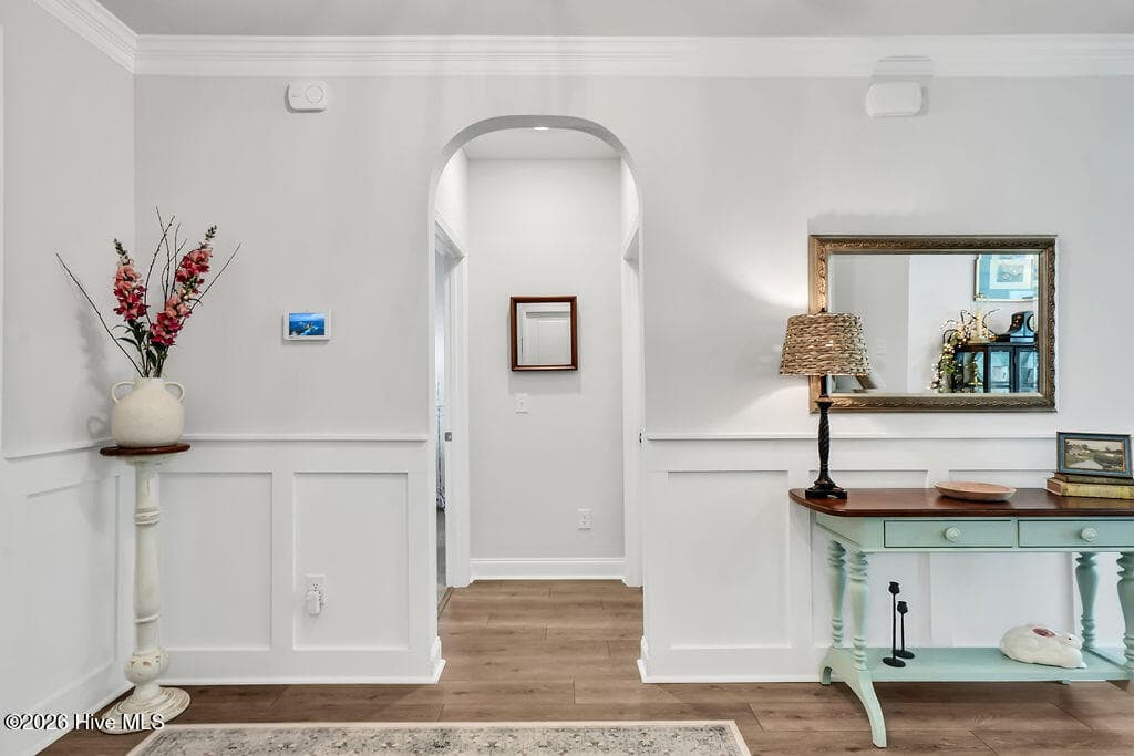 A wide foyer transitions into an open great room consisting of a large living room, enormous kitchen, and dining area. - 142 Rice Marsh Way, Wilmington, NC 28412