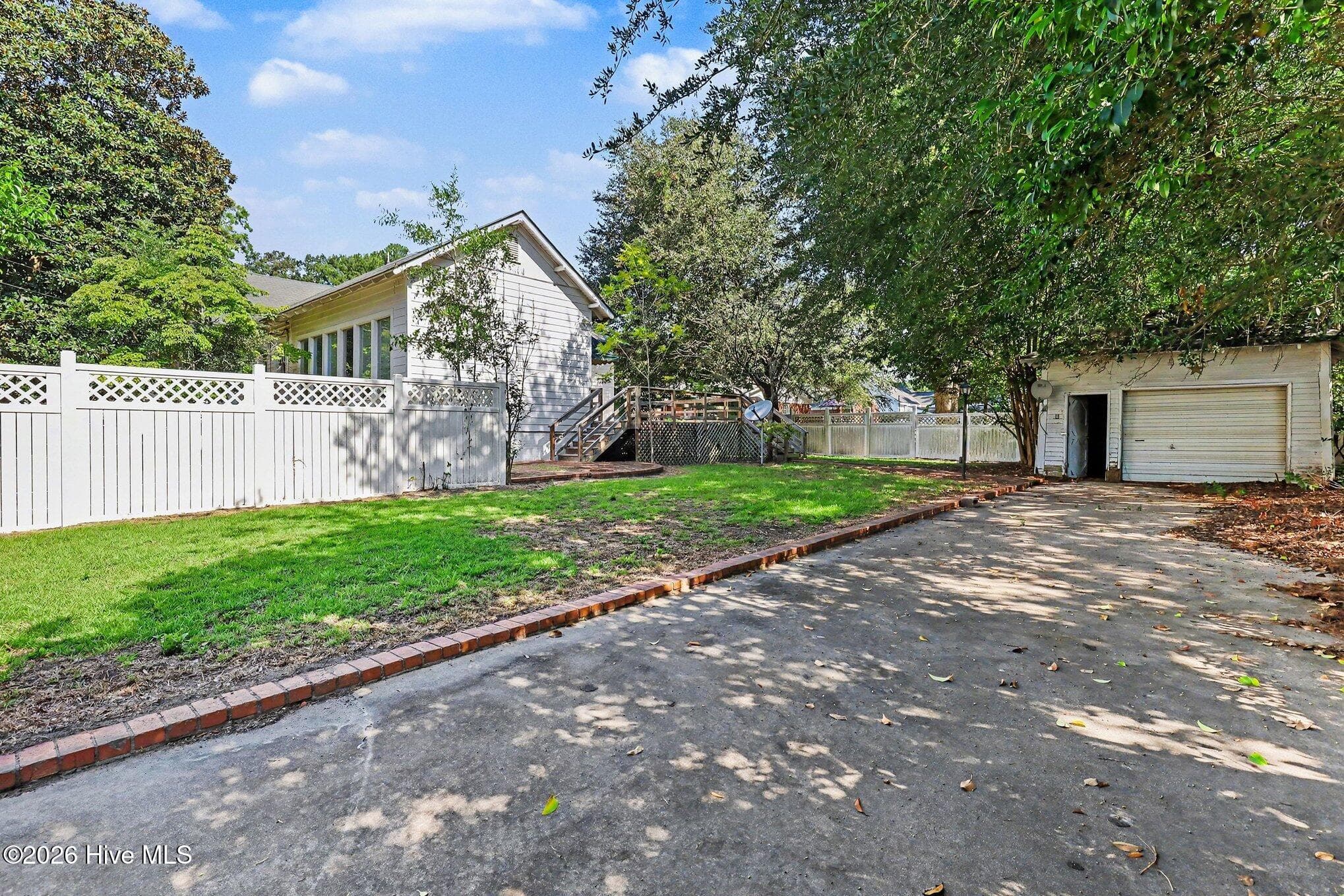 Vinyl fence back yard, concrete drive and detached garage - 202 N Green Street, Selma, NC 27576