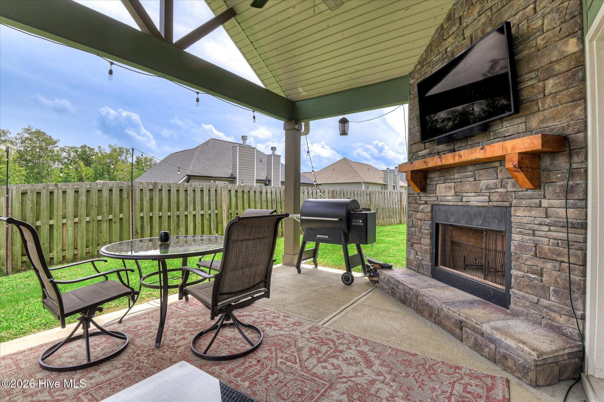 Backyard covered patio w/ wood burning fireplace - 257 Haverford Drive, Grovetown, GA 30813