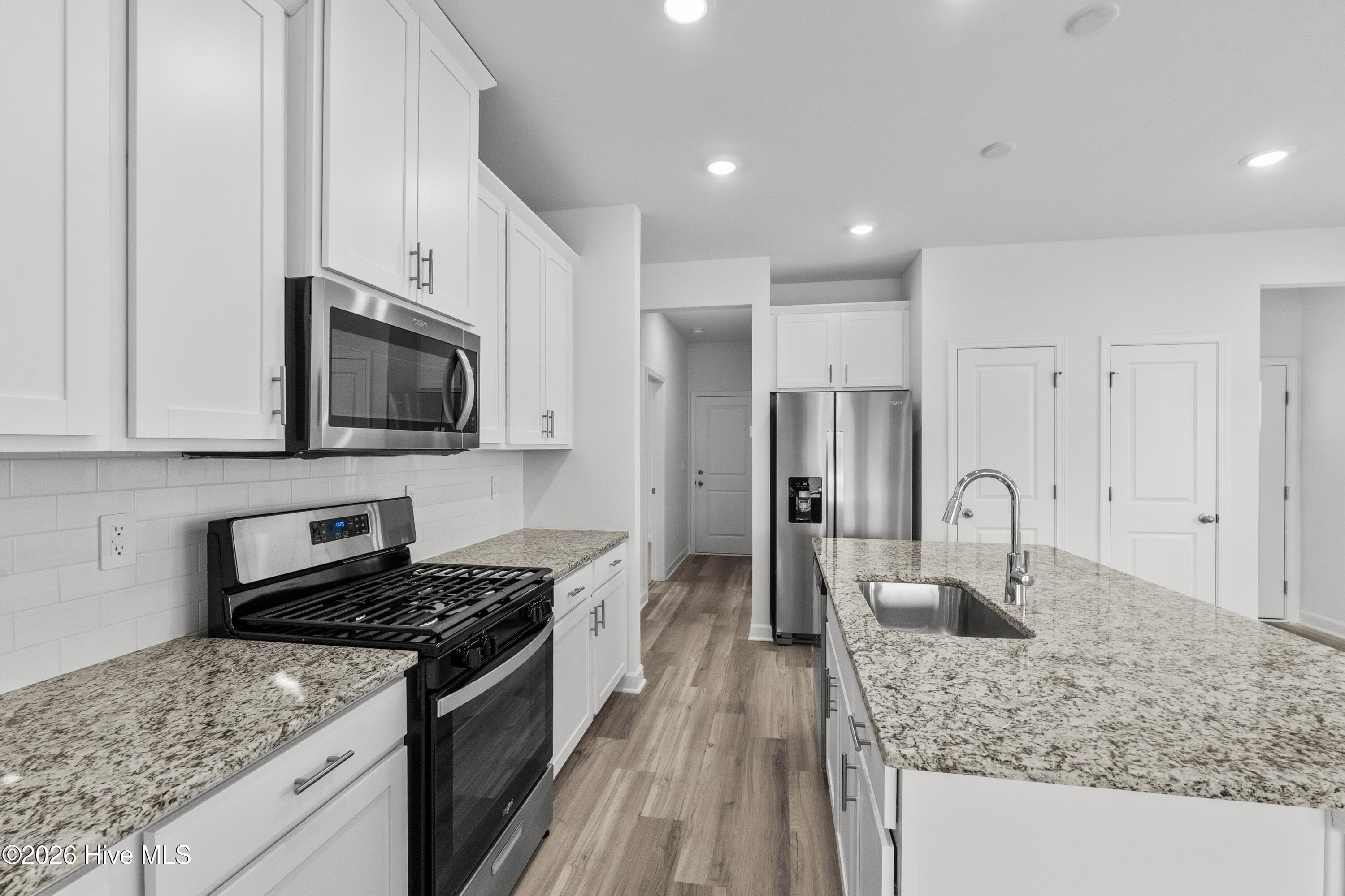 Photo is not of the actual home, but is an example photo of a completed home and may depict options and/or features that are not included - 2217 Lewis Allen Crossing NW, Ash, NC 28420