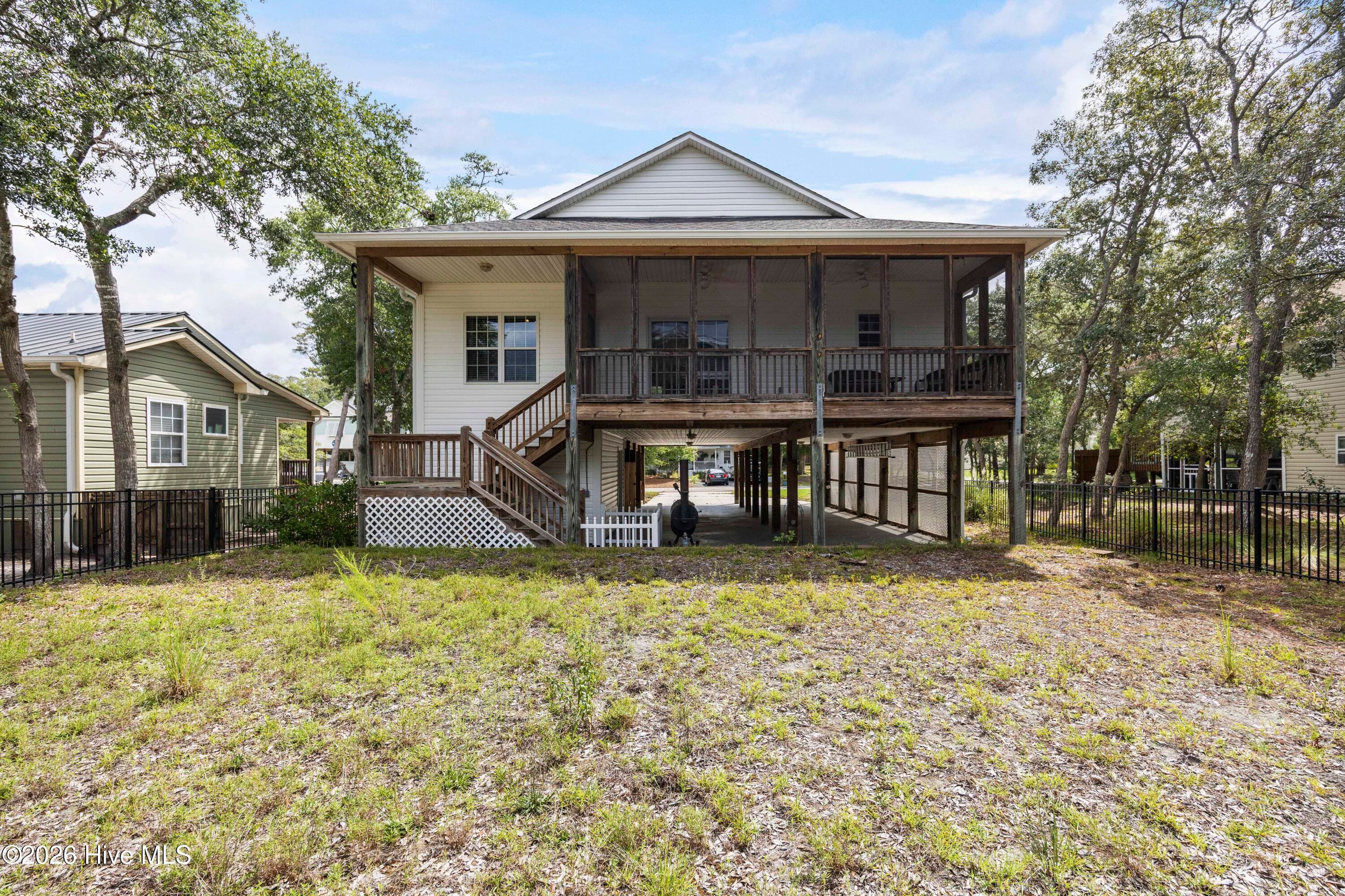 BACK YARD overlooked by Screened Porch - 225 NE 39th Street, Oak Island, NC 28465