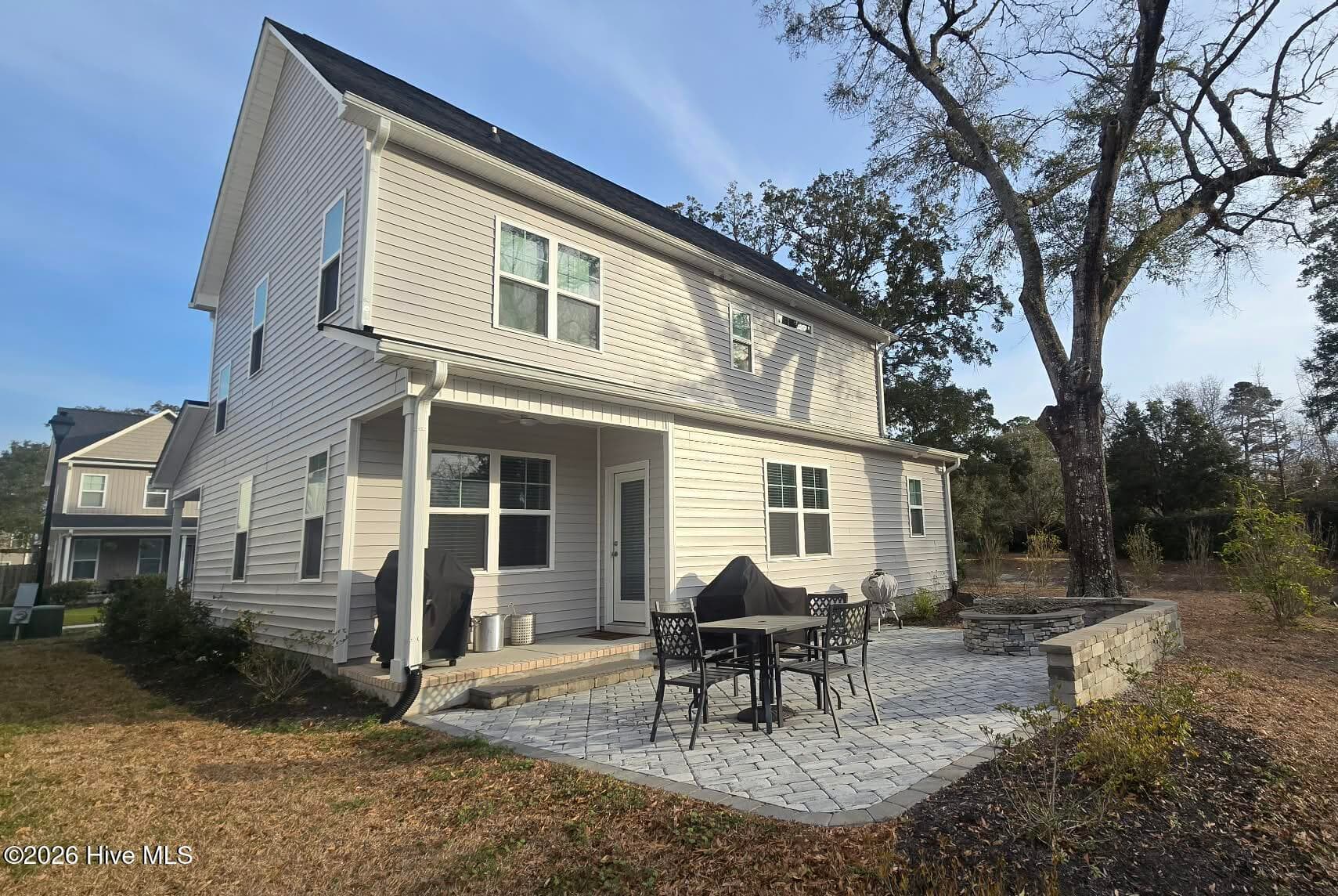 Entertain on your custom back patio with burn pit and grill pad. Watch wildlife relax and enjoy! - 1425 Eco Circle, Wilmington, NC 28409