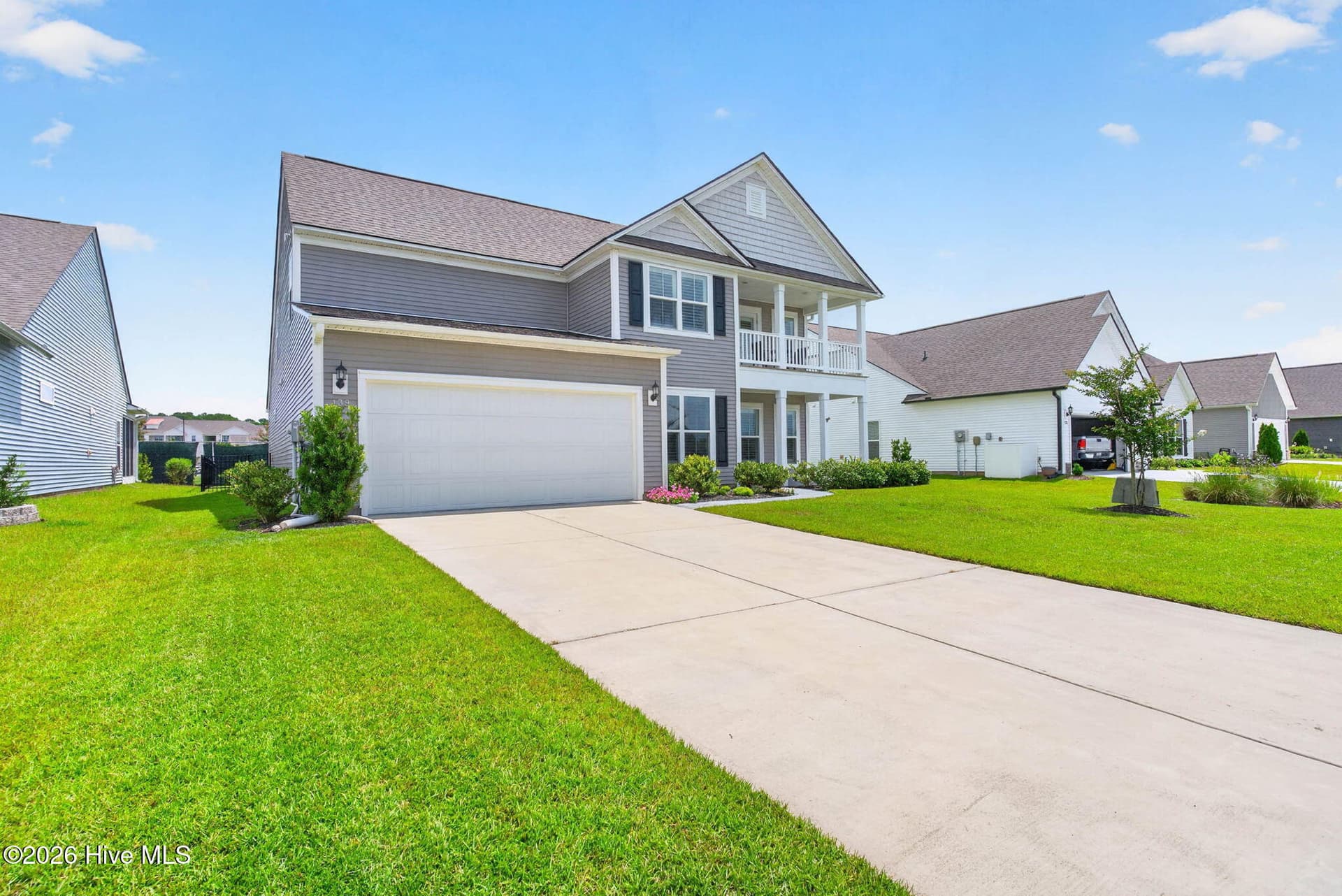 A wide driveway and attached two-car garage provide convenient parking at this move-in-ready Calabash home. - 139 Eagle Claw Drive, Calabash, NC 28467