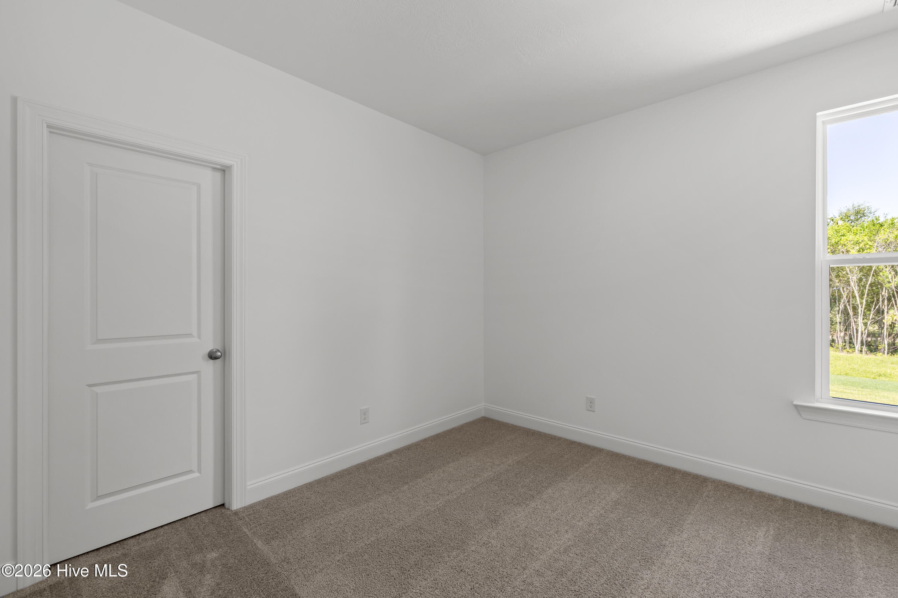 Bedroom 4 with a walk in closet - 1550 Bellingham Drive, Beech Island, SC 29842