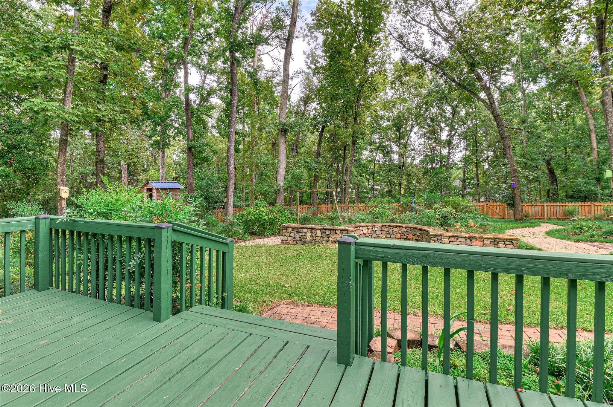 The backyard is a birder’s paradise, offering another reason to slow down and enjoy the expansive deck and intricate landscaping. - 307 Wakefield Lane N, Martinez, GA 30907