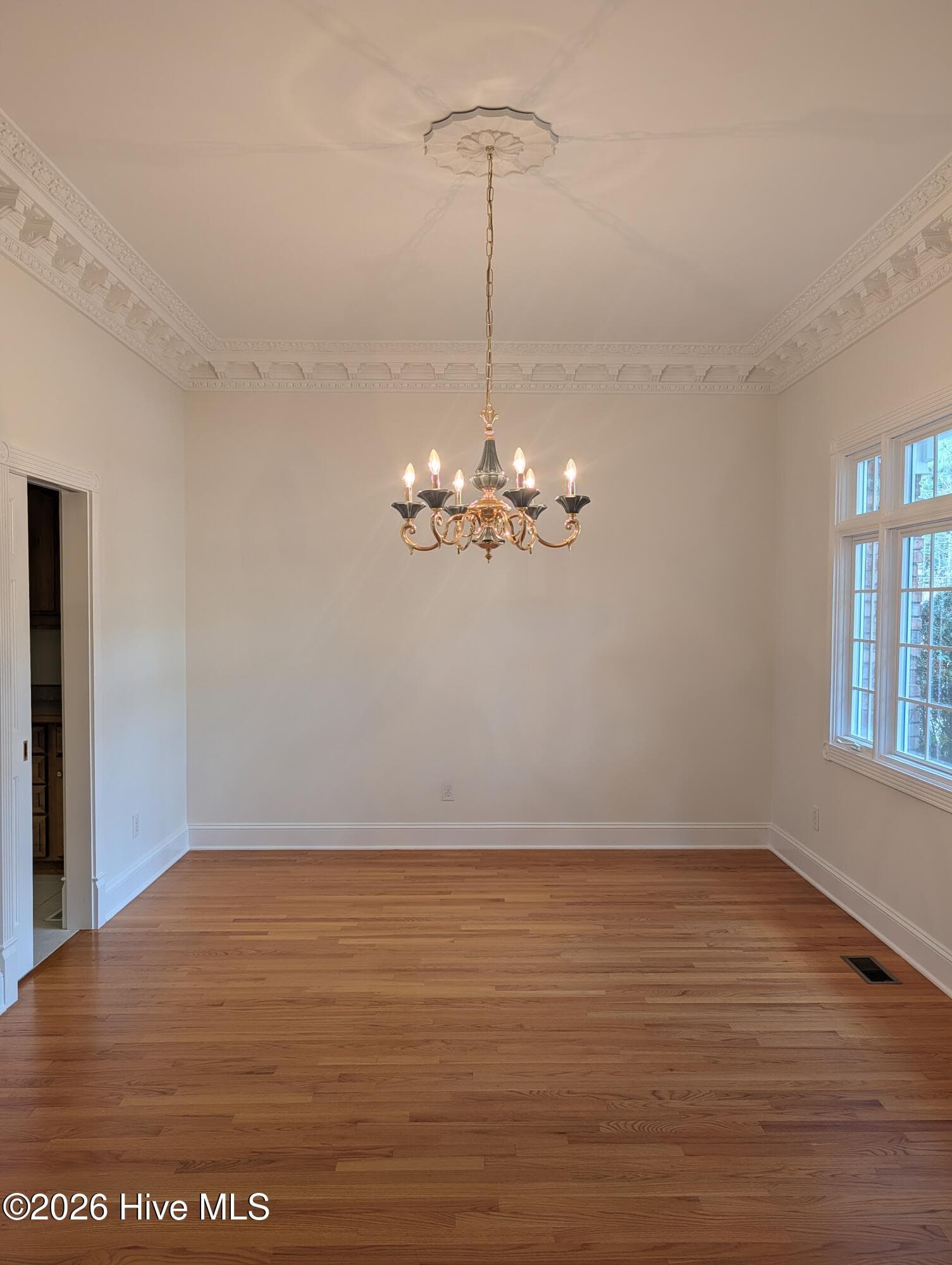 View of Dining Room which is to the right off the foyer. Door to the left is the butlers pantry. - 22 Lochmere Drive, Pinehurst, NC 28374