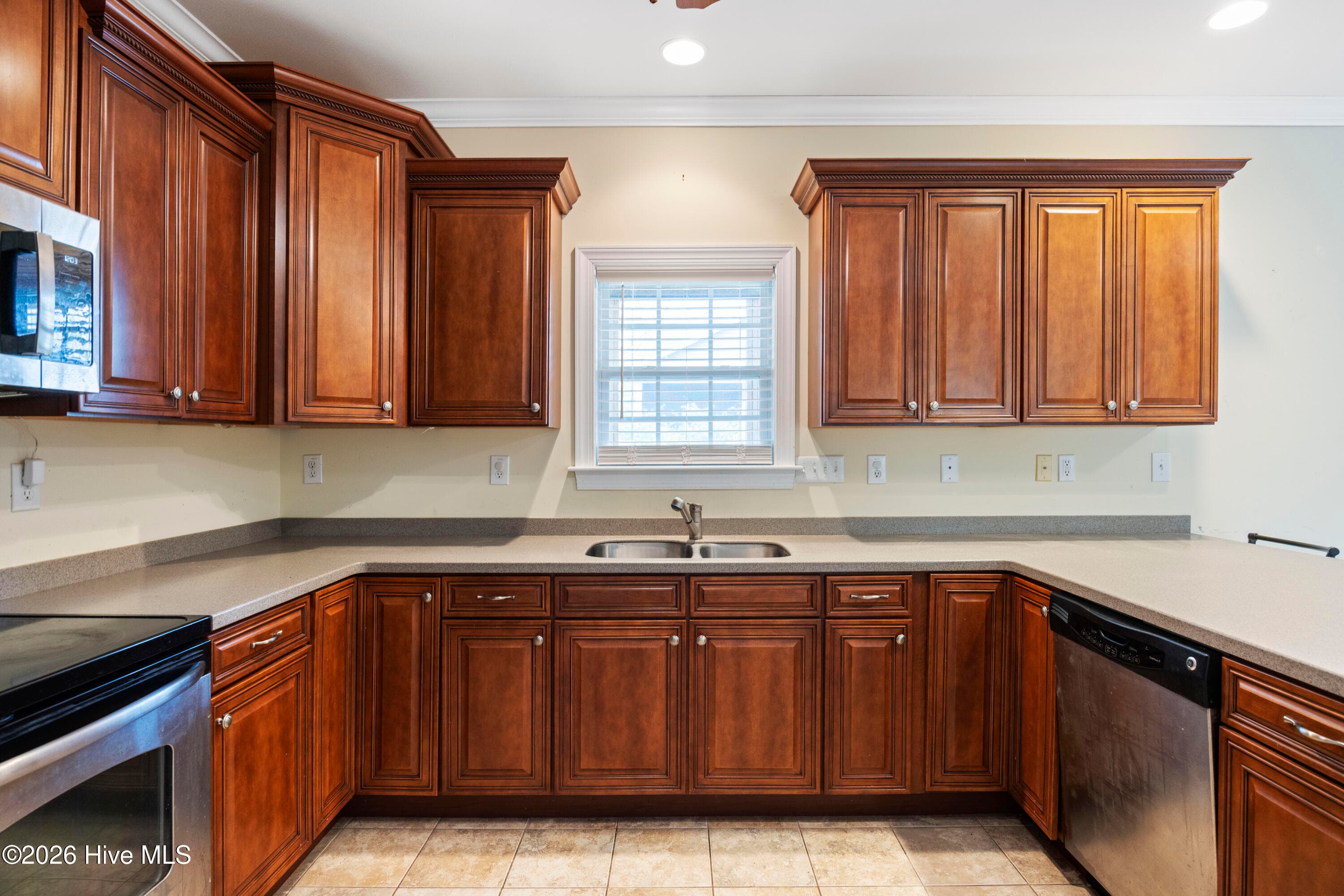 KITCHEN featuring wraparound counters and cabinets - 225 NE 39th Street, Oak Island, NC 28465