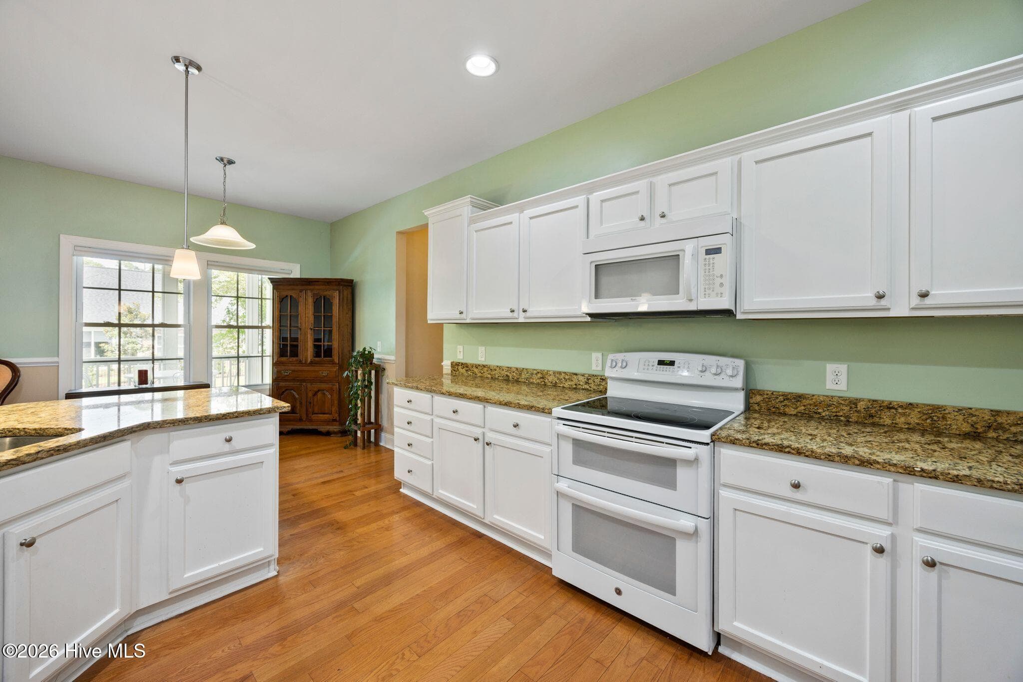 Popular 2-oven stove. A plethora of cabinets for all your storage needs. - 1620 Golfers Ridge Drive SE, Bolivia, NC 28422