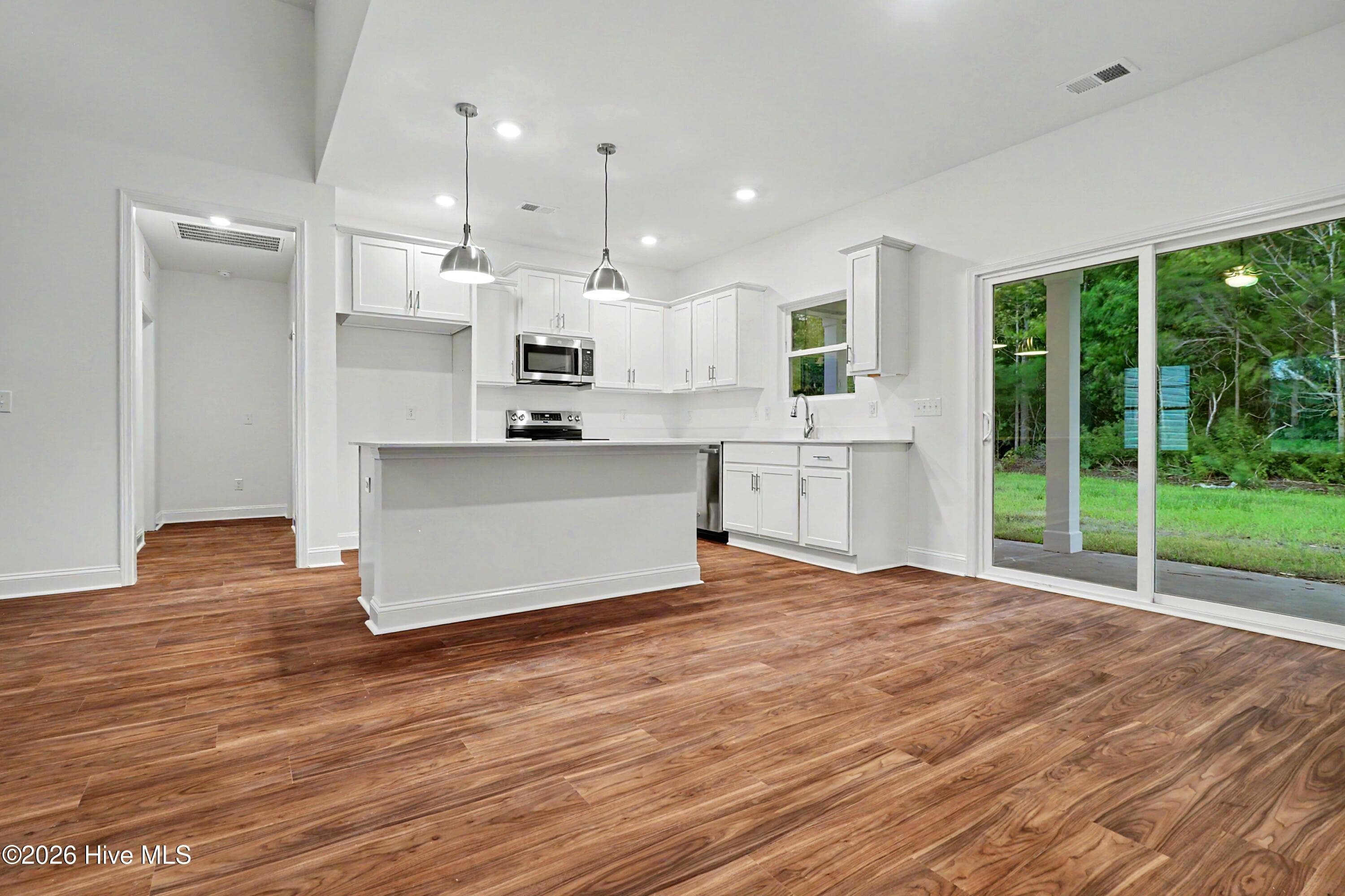 Kitchen has large island for entertaining. - 2111 Cregan Cove SW (Lot 19), Ocean Isle Beach, NC 28469